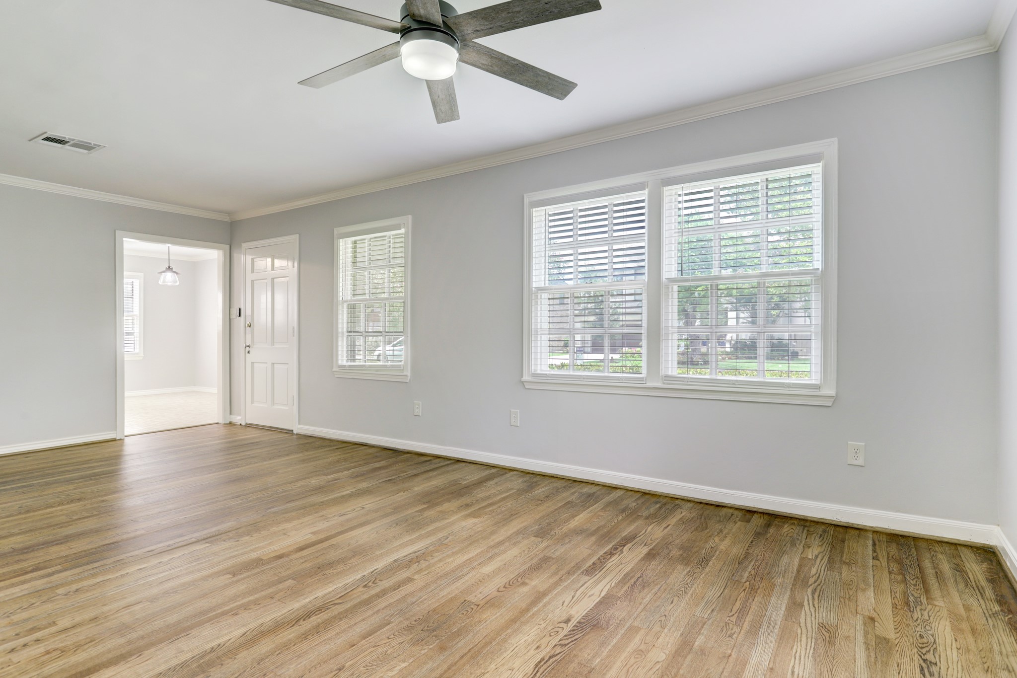 Living room with view of breakfast room entry