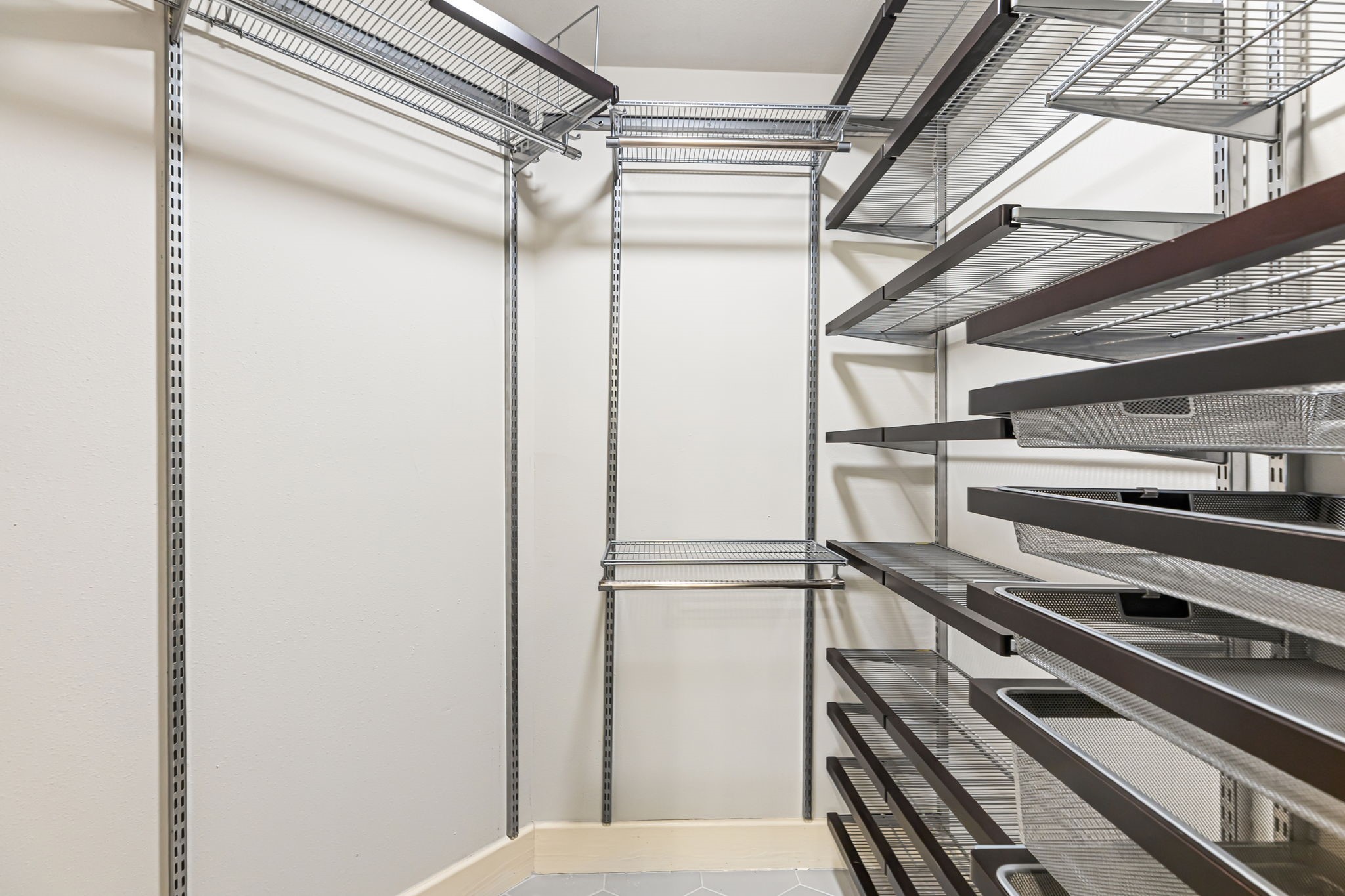 Walk-in closet in primary suite.
