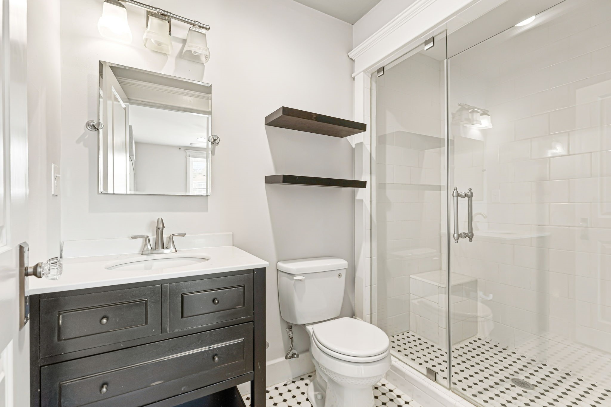 Full bath with walk-in shower in the garage apartment.