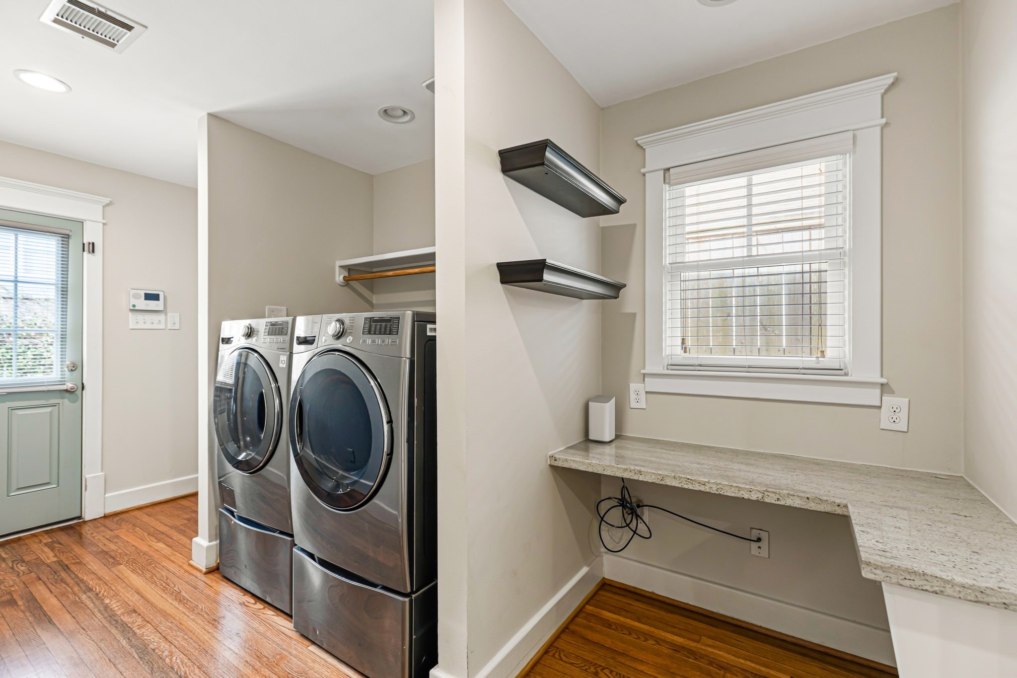 Laundry area with extra storage.