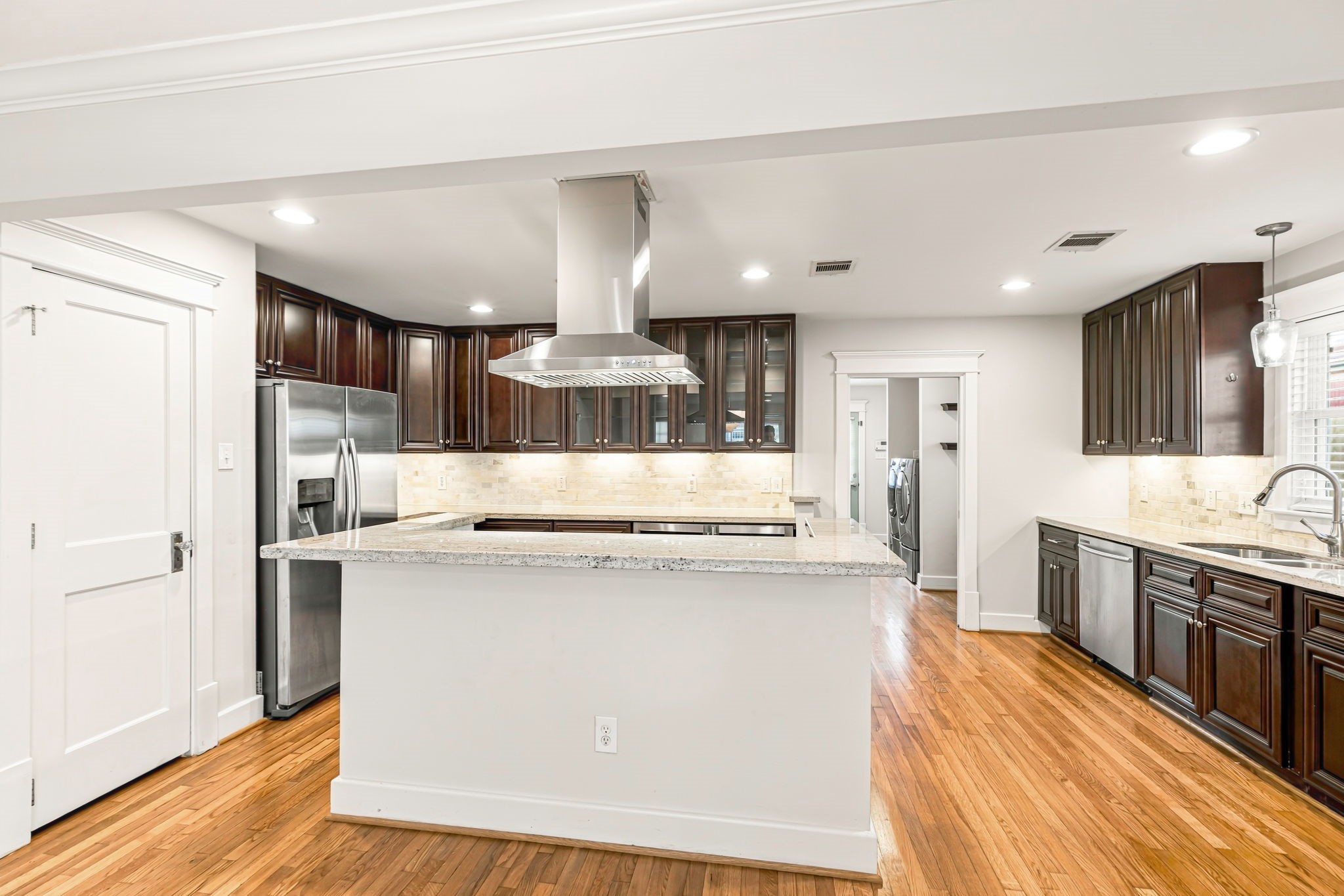 Tons of cabinets and counter space plus and nice sized pantry. Recessed lighting and nice big windows make this home light and bright.