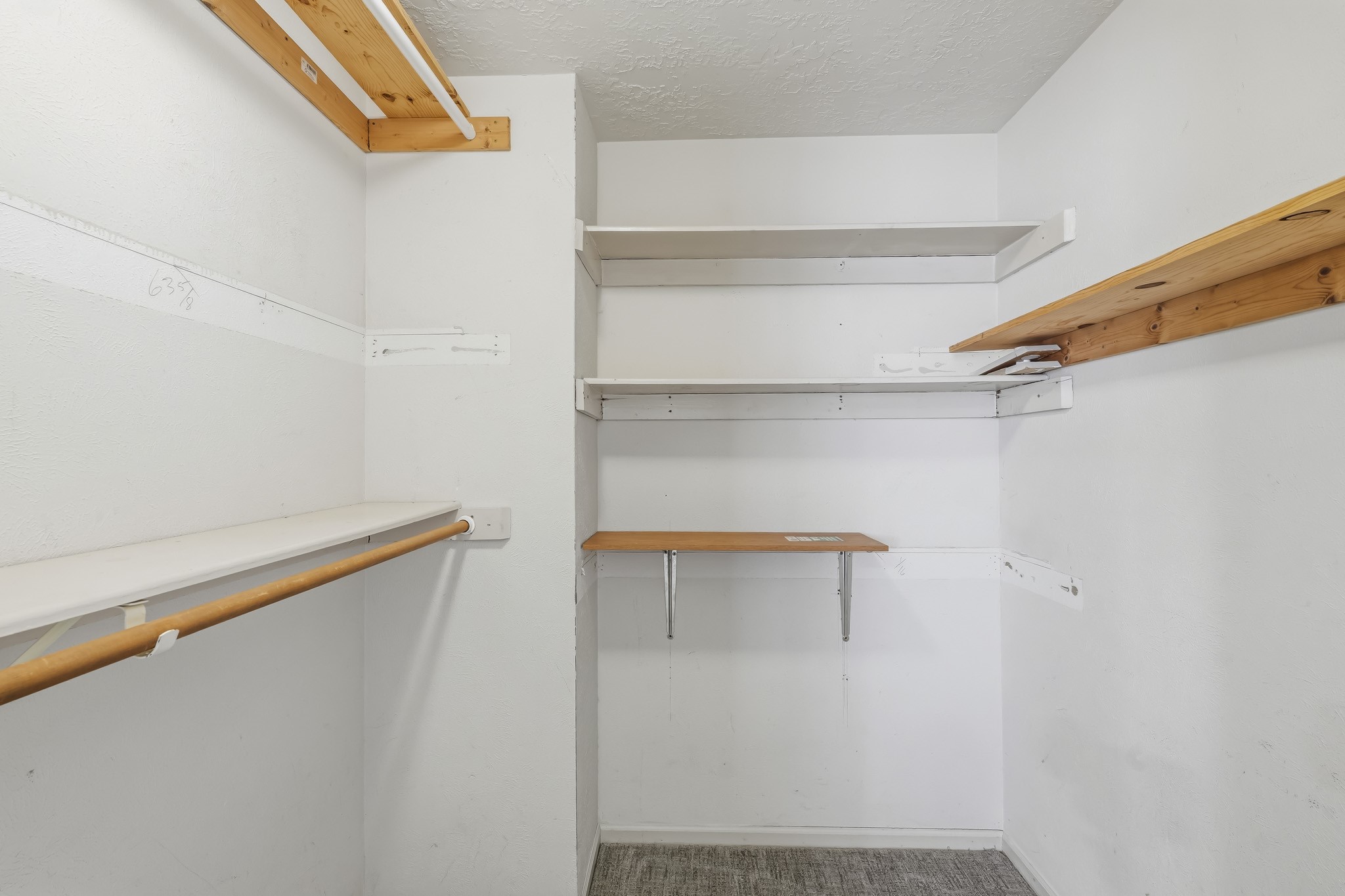 One of two master closets. The generous layout provides plenty of room to organize clothing, shoes, and accessories while keeping everything easily accessible.