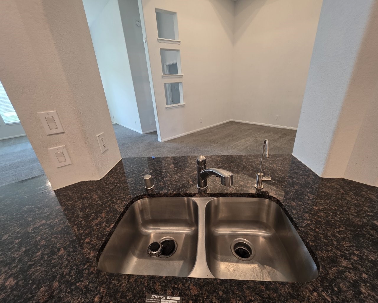 Kitchen opens to the living and dining rooms Kitchen opens to the living and dining rooms