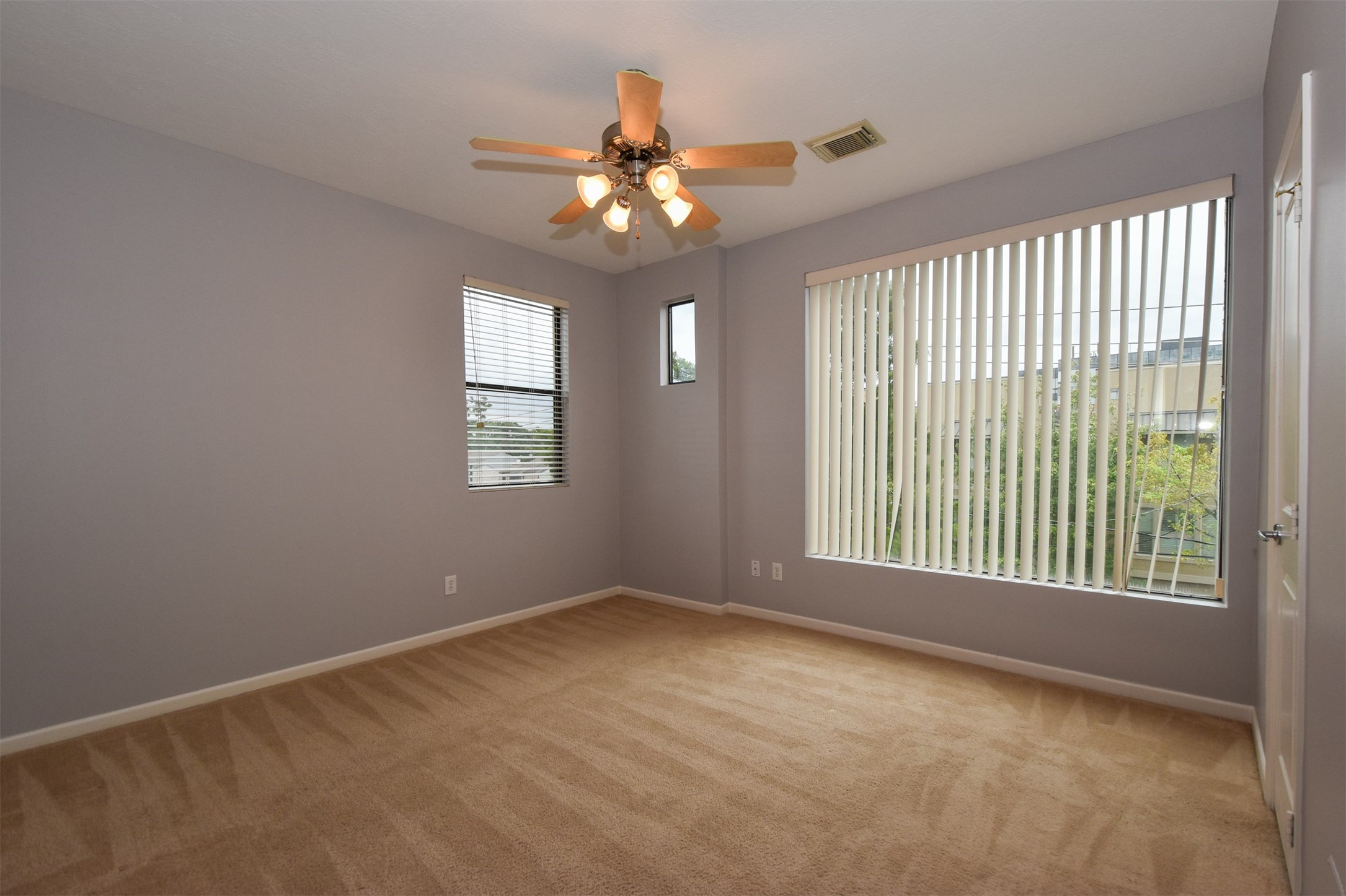 Large secondary bedroom upstairs on third floor