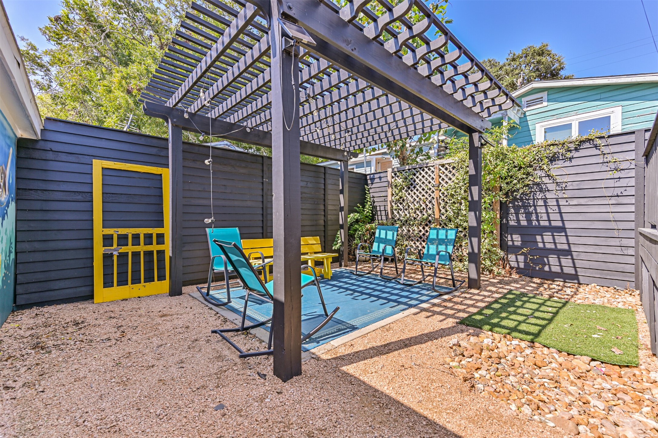 Another View of the Low Maintenance Yard - Complete with a Small Patch of Grass, Perfect for Confined Animal Visits to the Backyard Area!