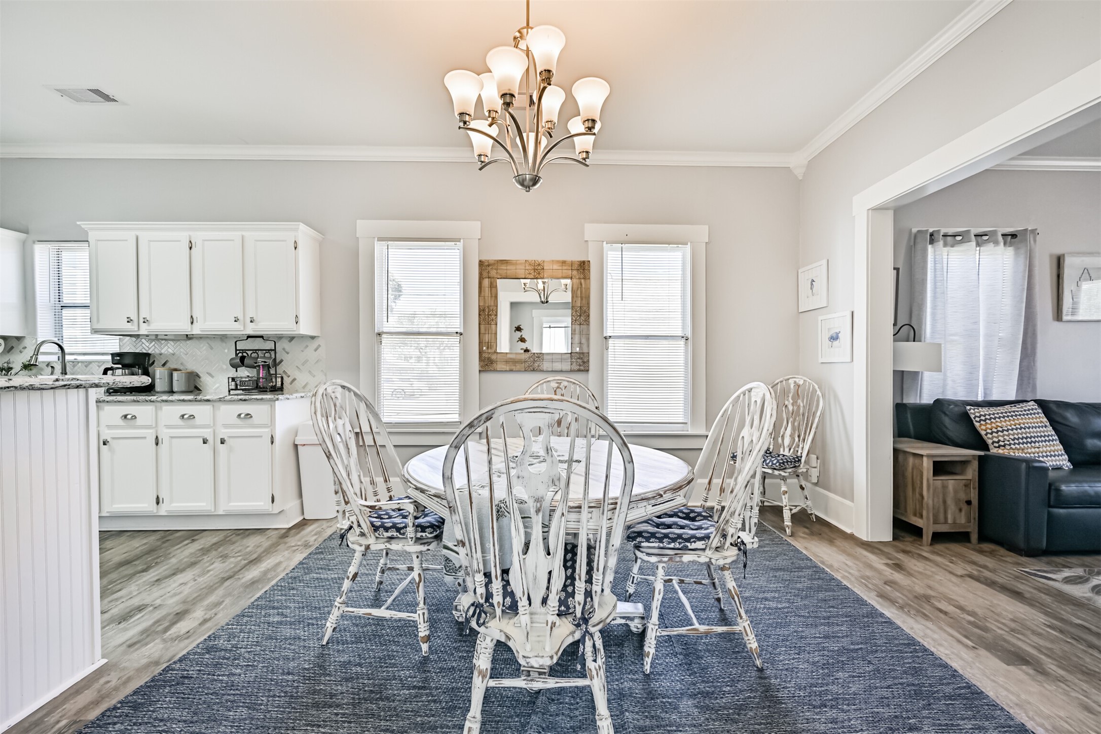 This Perspective from the Bedroom Hallway Towards the Dining and Kitchen Area. The Large Open Archway Defines the Space but Allows for Great Flow Between the Rooms.