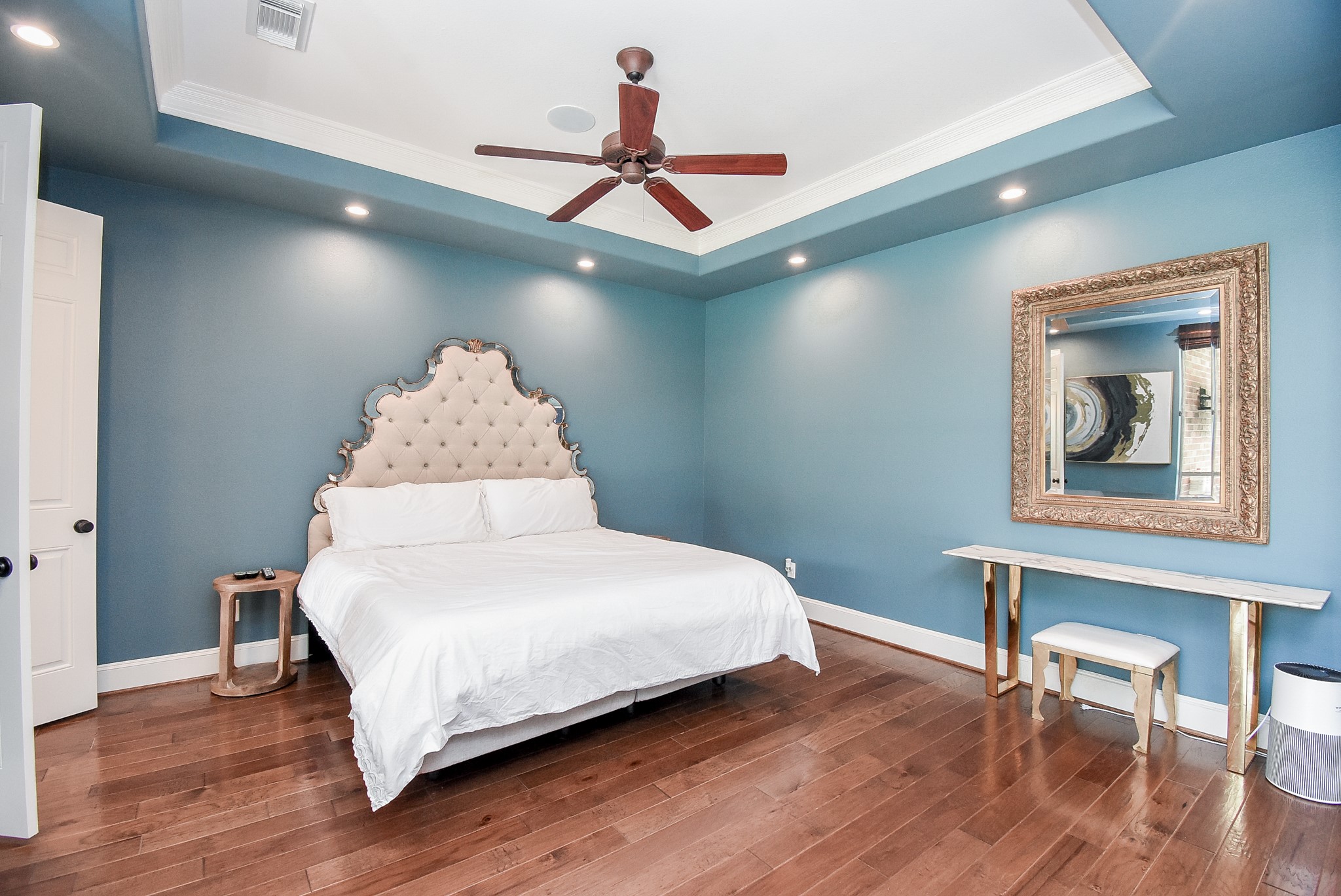 Plenty of wall space for all your furnishings. Ceiling treatment adds a nice contrast to the custom painted walls.