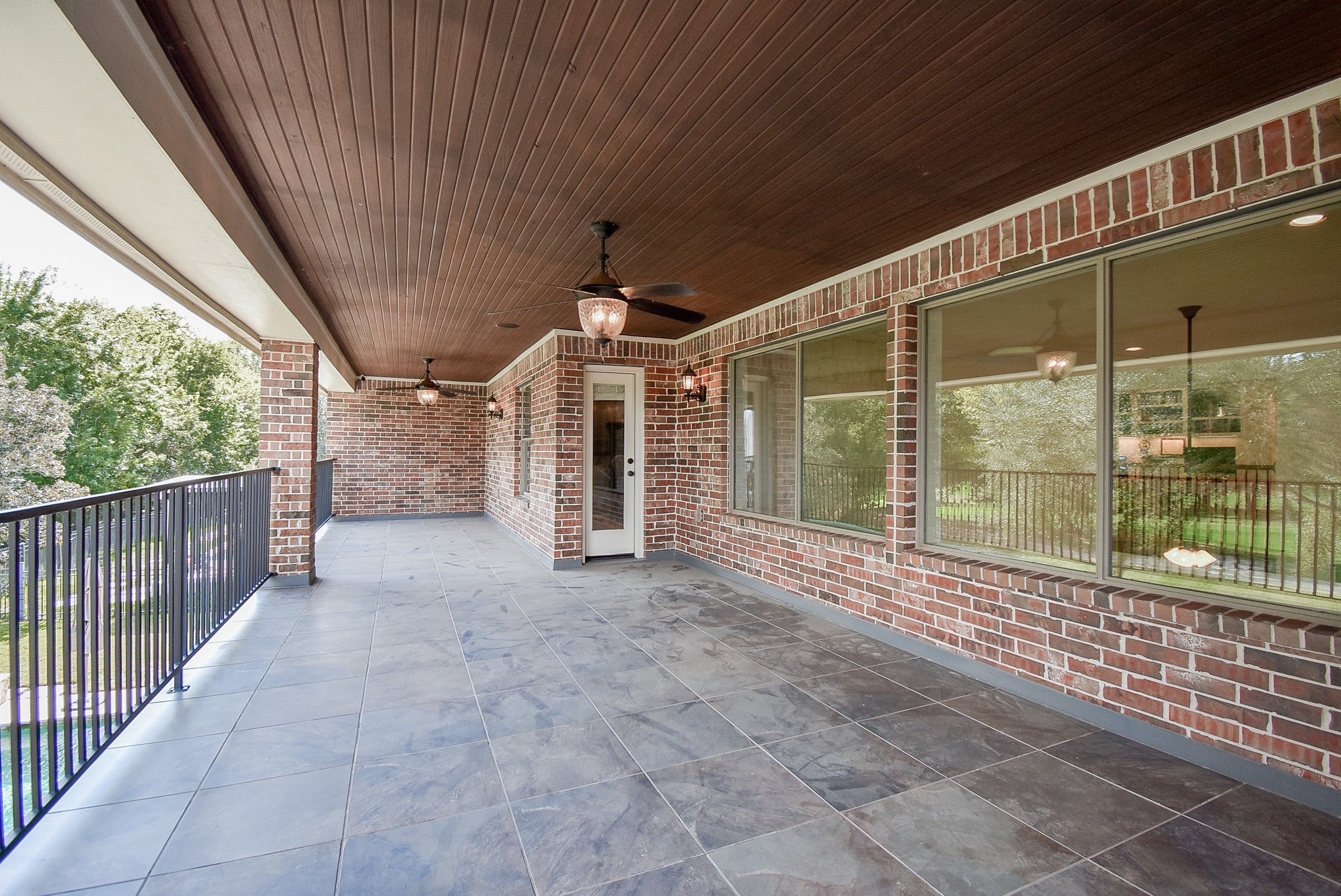 Second view of the covered balcony showing access to bedroom three