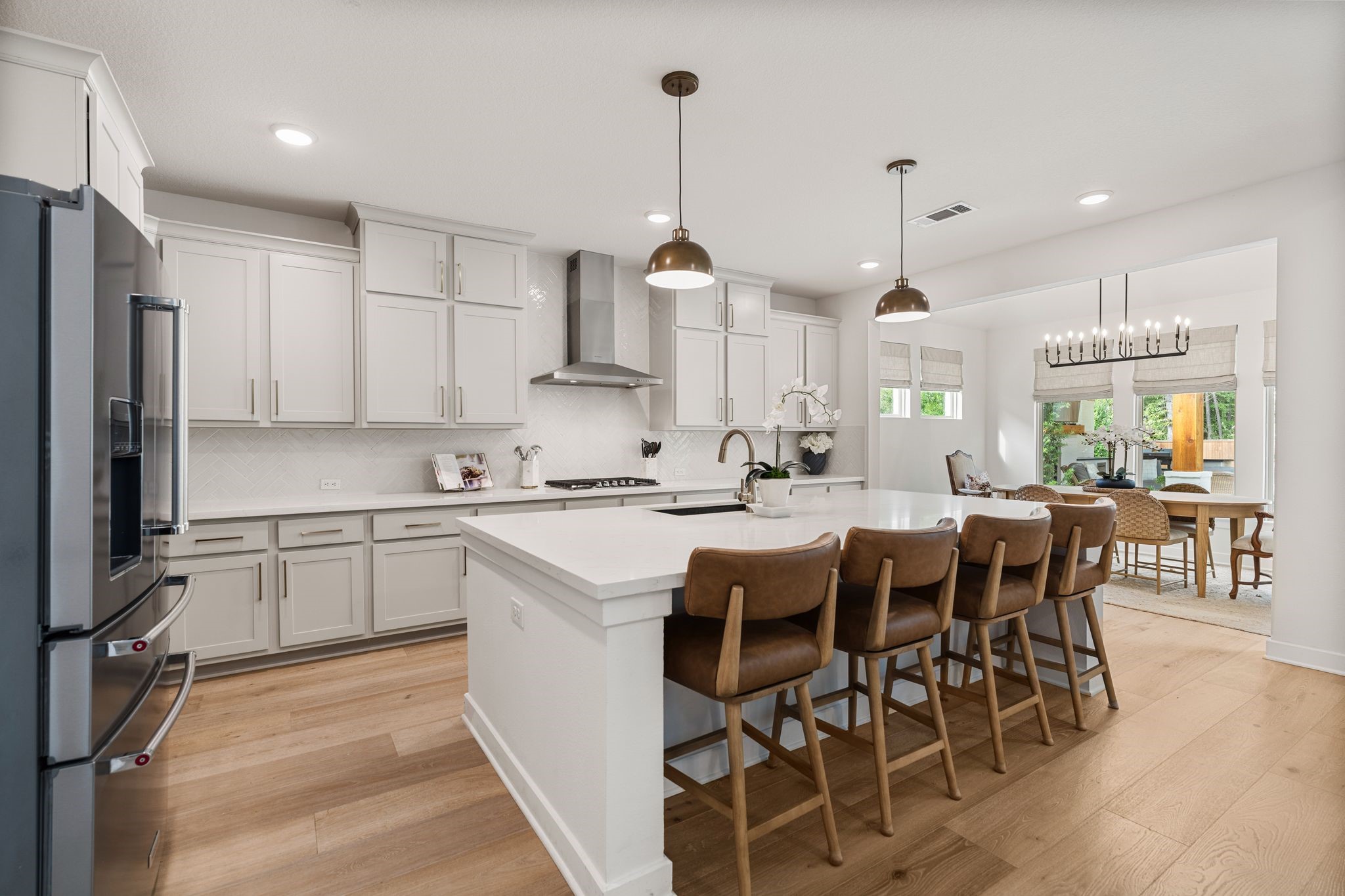 The open-concept design flows seamlessly into the dining area, creating the perfect space for everyday living and entertaining!