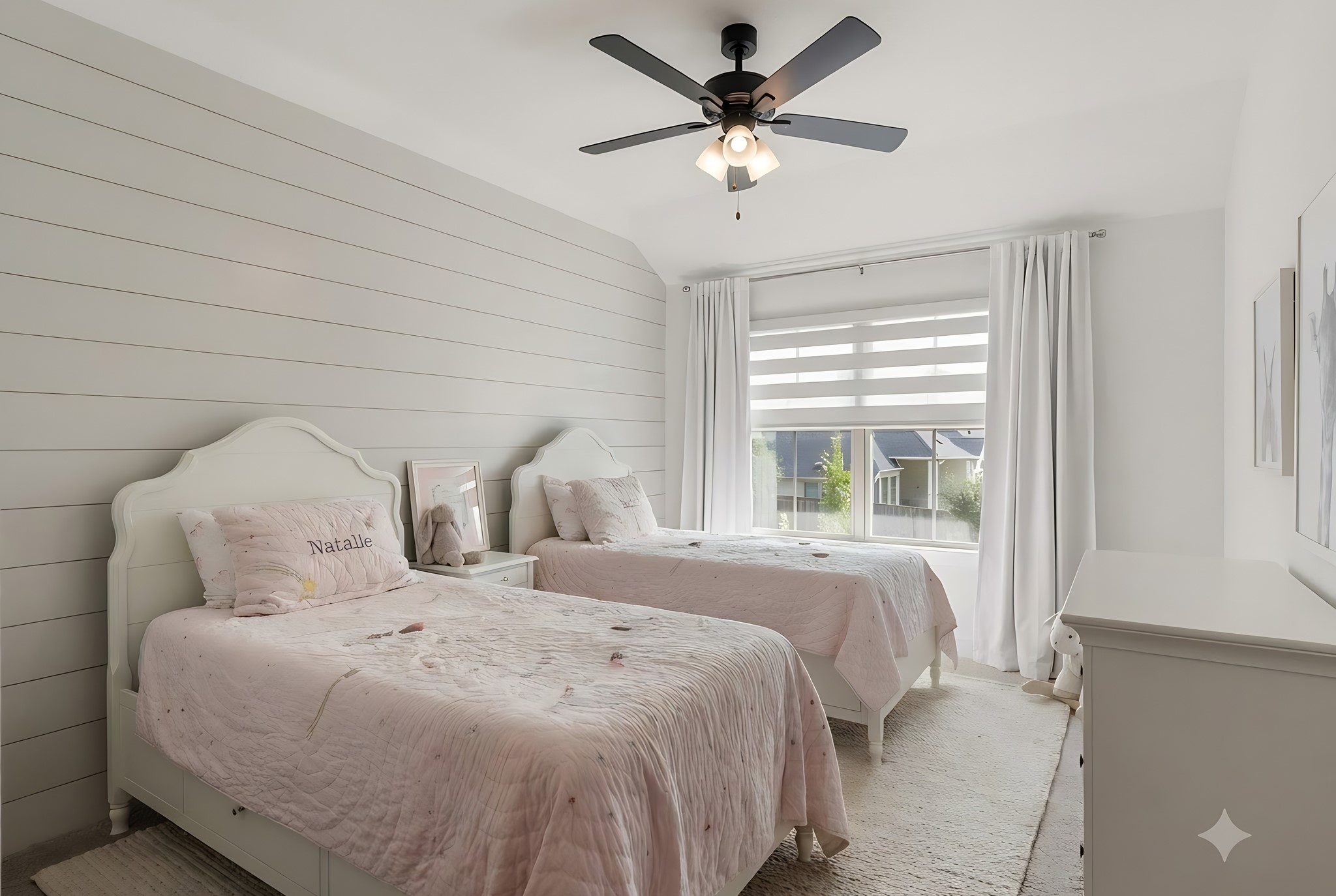 Beautifully appointed second upstairs secondary bedroom featuring a charming shiplap accent wall, custom window shades, and abundant natural light. Conveniently connected to a Hollywood-style bath, offering both privacy and functionality with stylish finishes throughout!