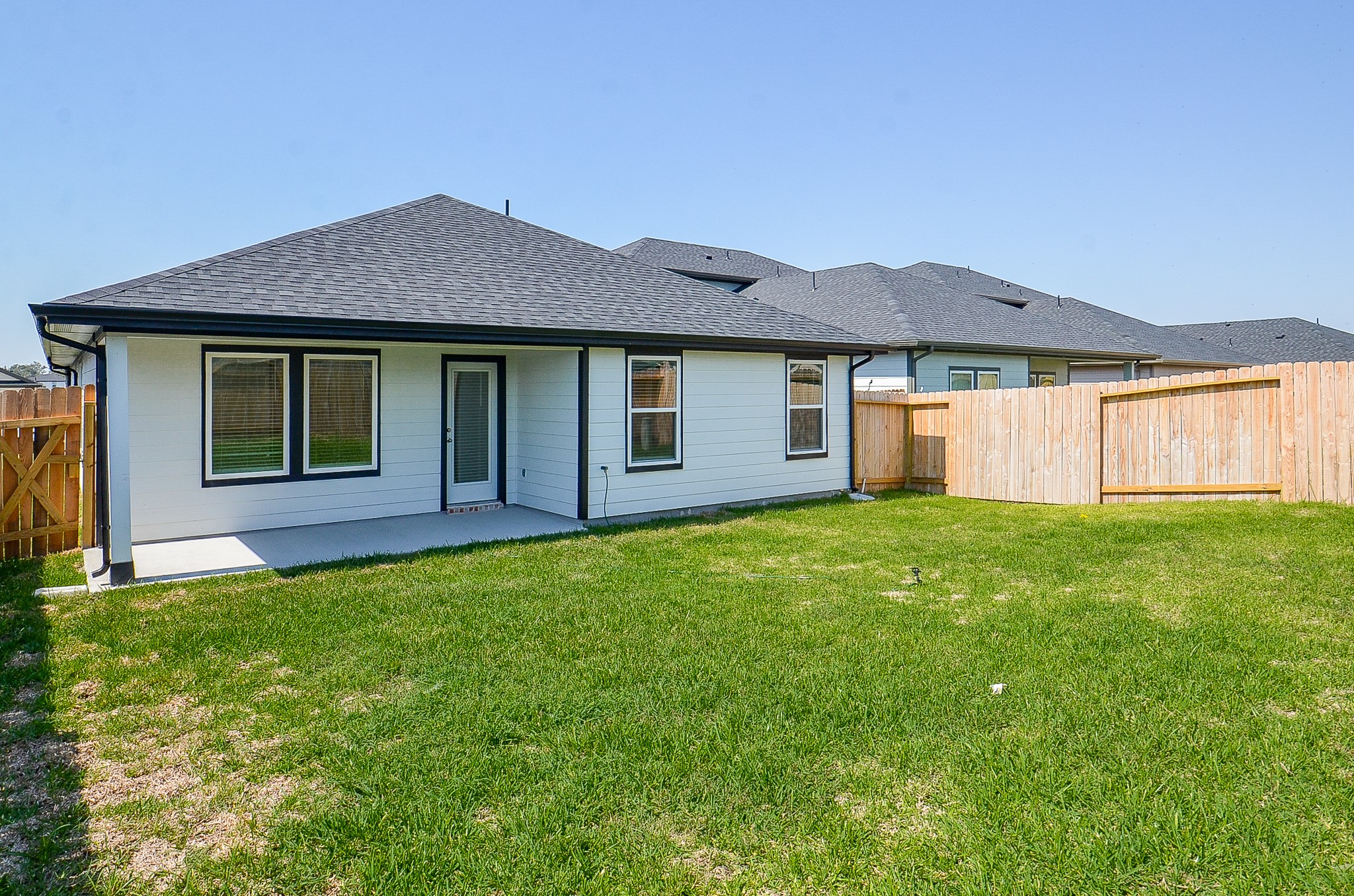 Charming single-story home with a spacious fenced backyard, perfect for outdoor activities and relaxation.