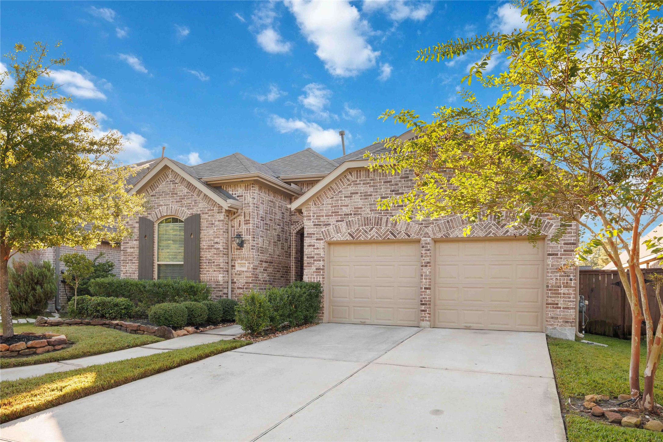 Charming brick home with a two-car garage, well-maintained landscaping, and a spacious driveway. Perfect for families seeking a welcoming neighborhood setting.