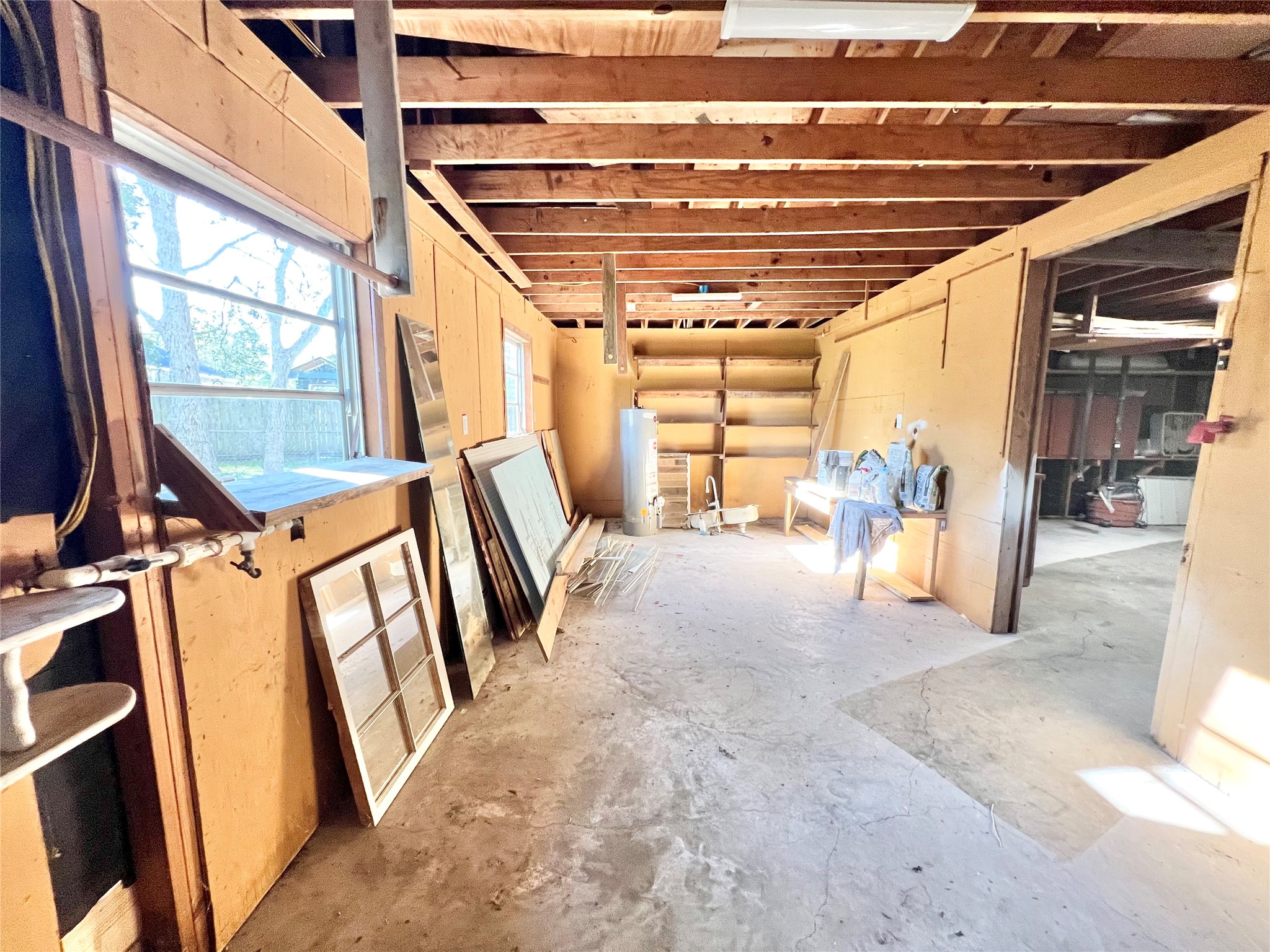 Still need another workshop or storage area, we have that too, it is in the back of the oversized 2 car garage.  This whole area could very easily be turned into additional guest quarters, water has been run to it and this practically new hot water heater could possibly stay if needed, finish it out and tie into the existing septic and you have another apartment or guest quarters with a little bit of work.