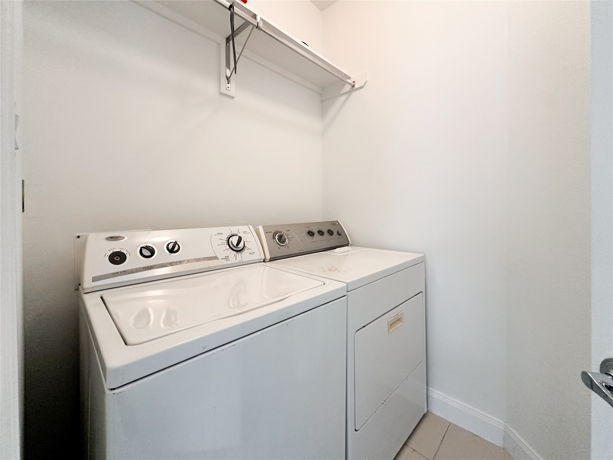 Utility room with washer and dryer