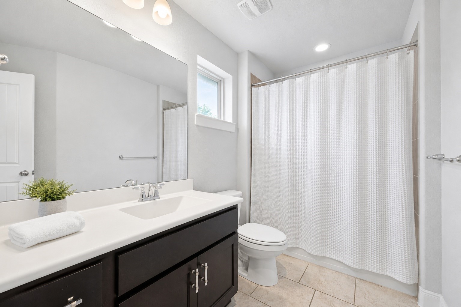 Ensuite bathroom for the second Primary bedroom upstairs.