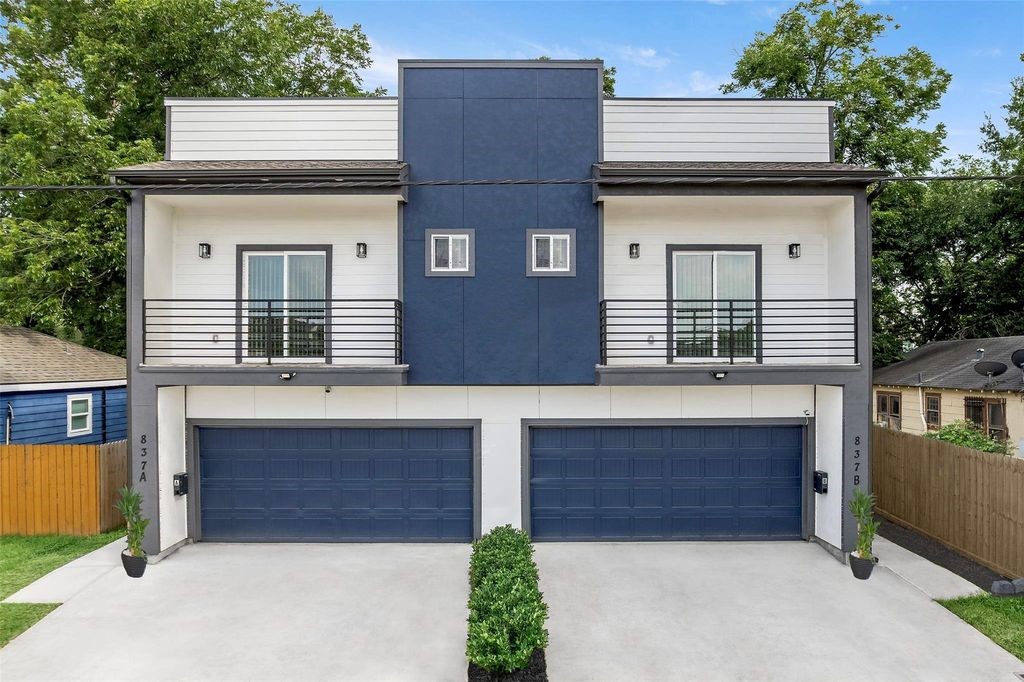 Contemporary Northwest Houston multifamily property featuring modern architecture, private entrances, and attached garages.
