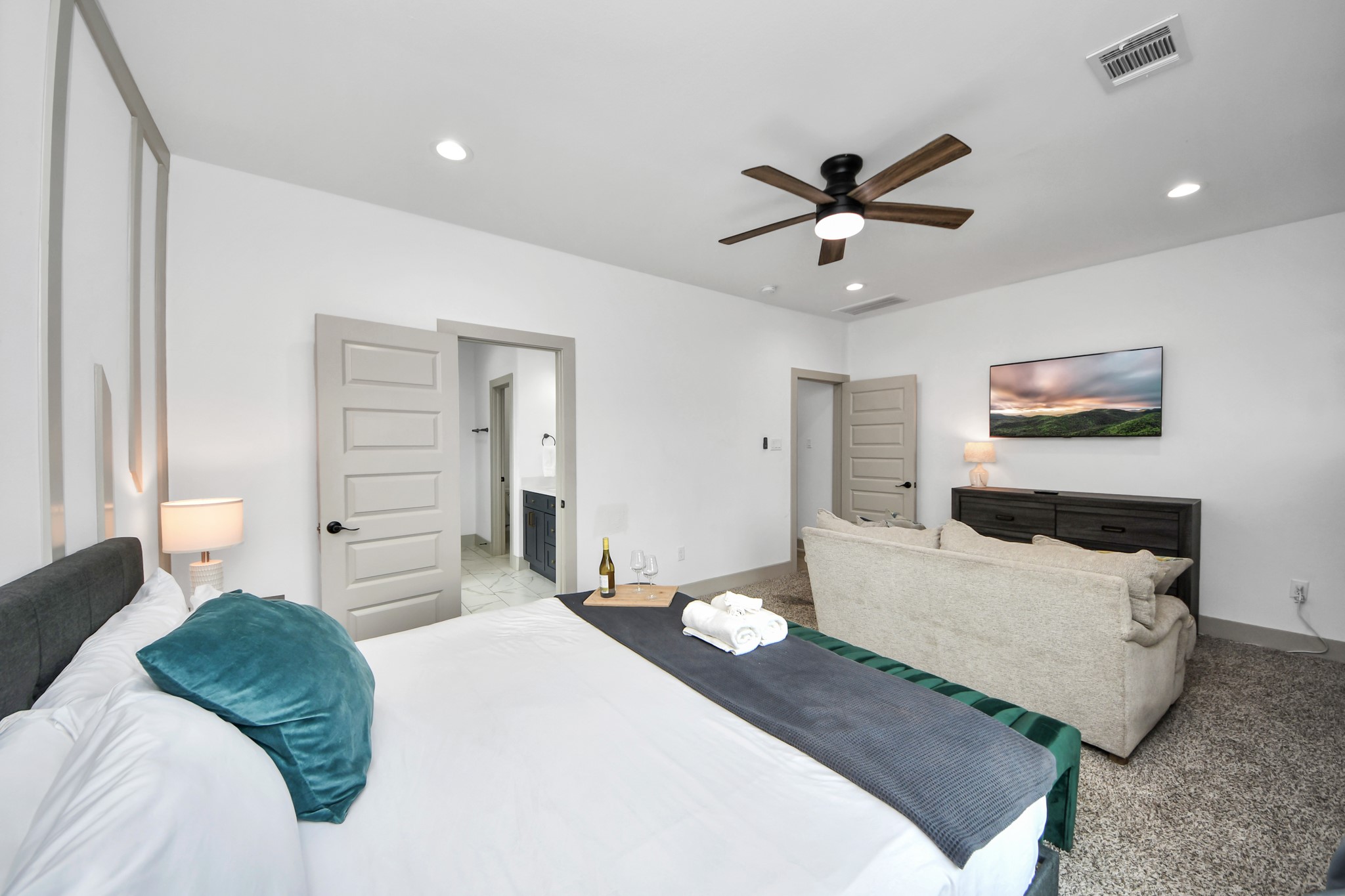 Spacious primary bedroom offering a comfortable private retreat in this modern 77091 duplex.