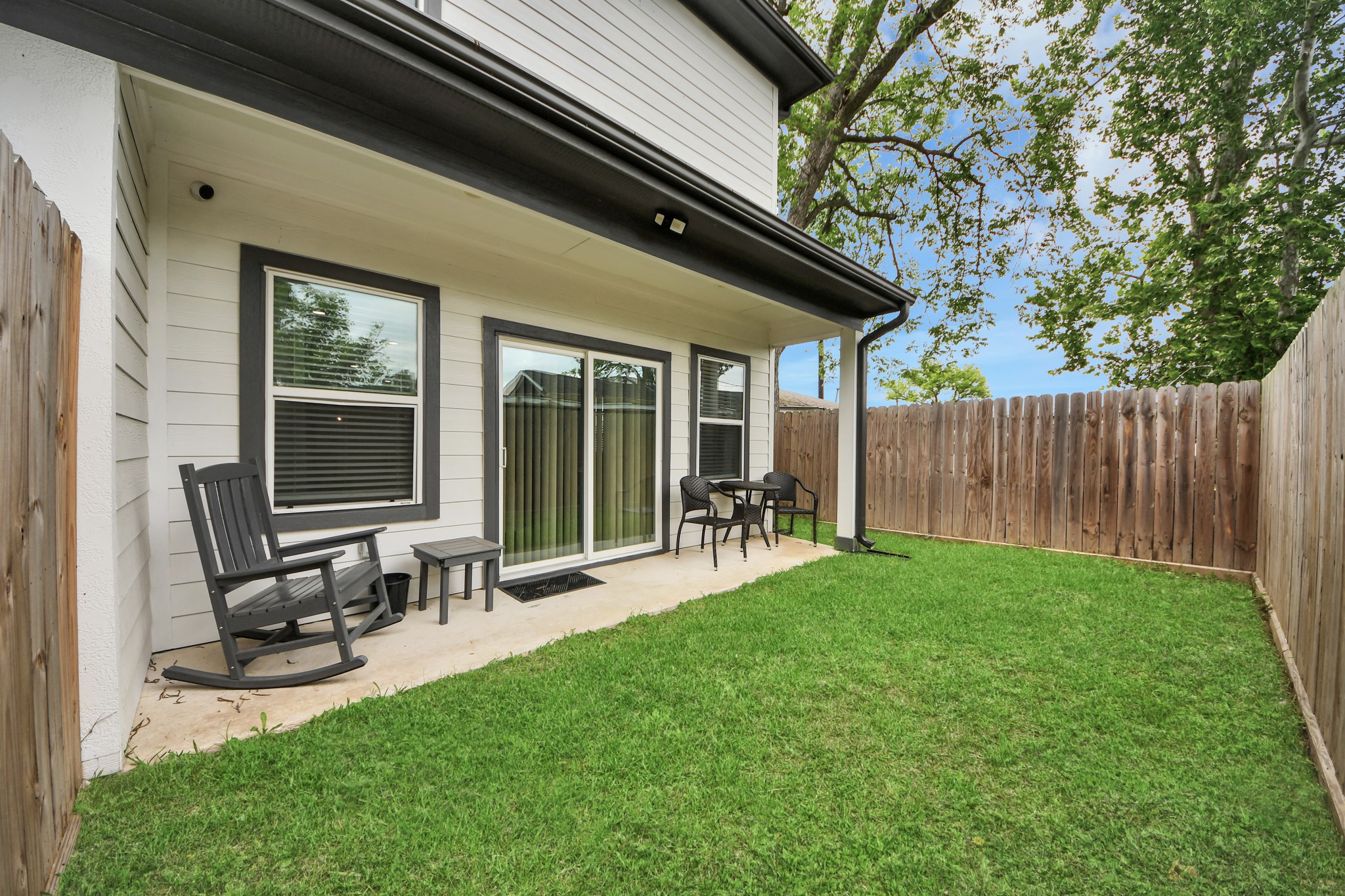 Covered outdoor patio extends the living space and creates an inviting area for relaxing or entertaining.