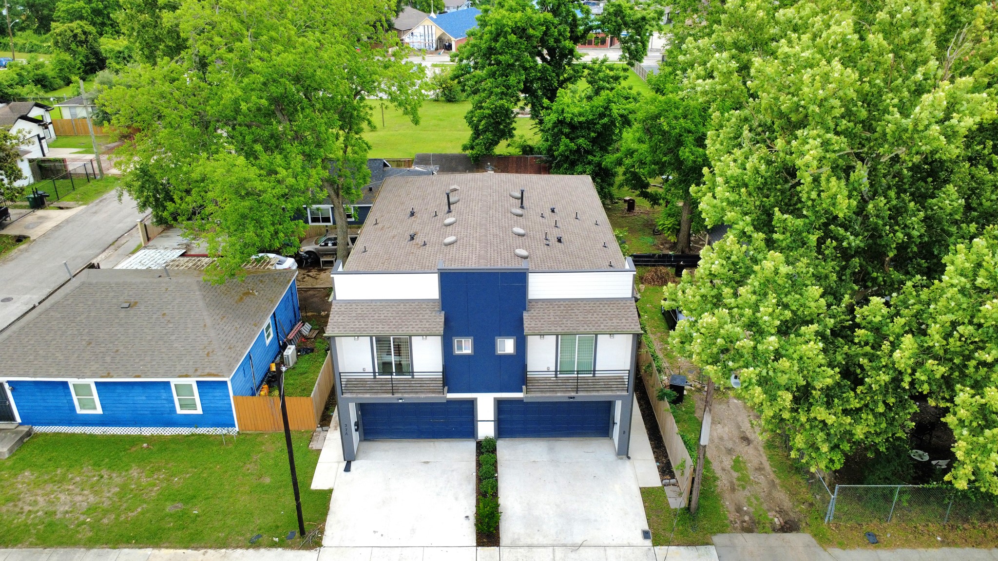Private driveway and attached garage access add everyday convenience for each side of this modern duplex.