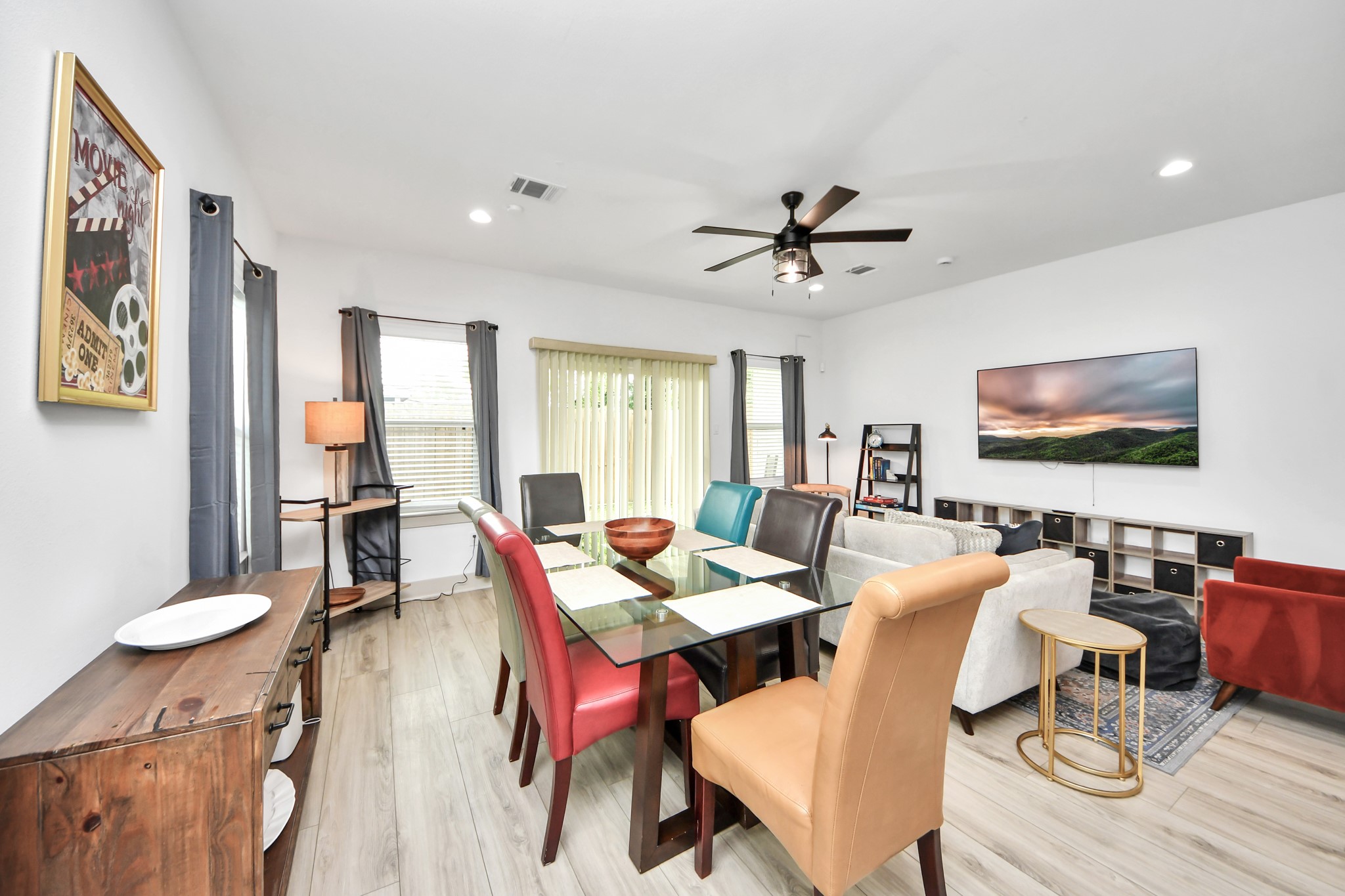 Spacious living area with an open floor plan connecting seamlessly to the kitchen and dining spaces.