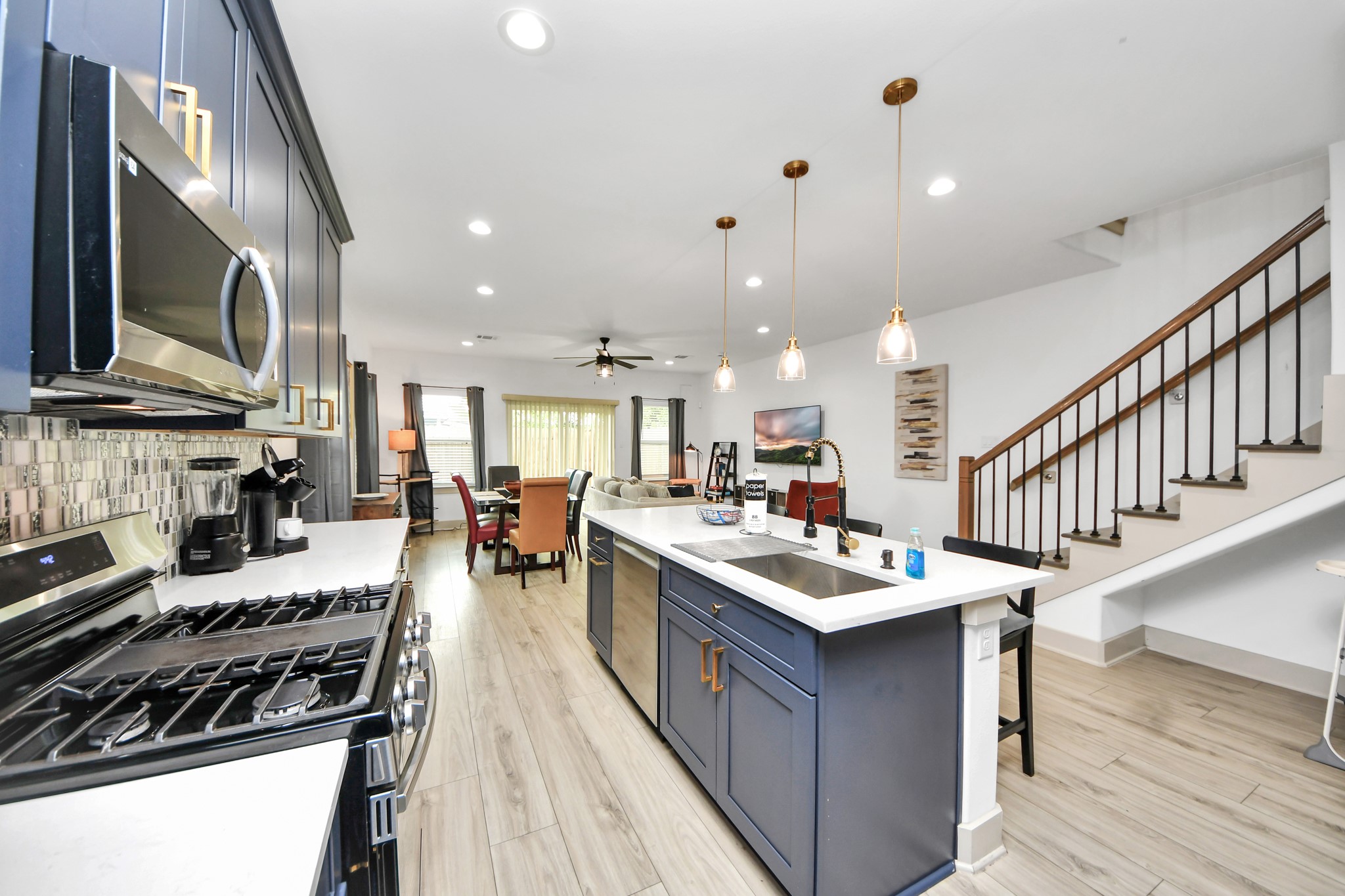 Open-concept kitchen and living area designed for entertaining with modern finishes and abundant natural light.