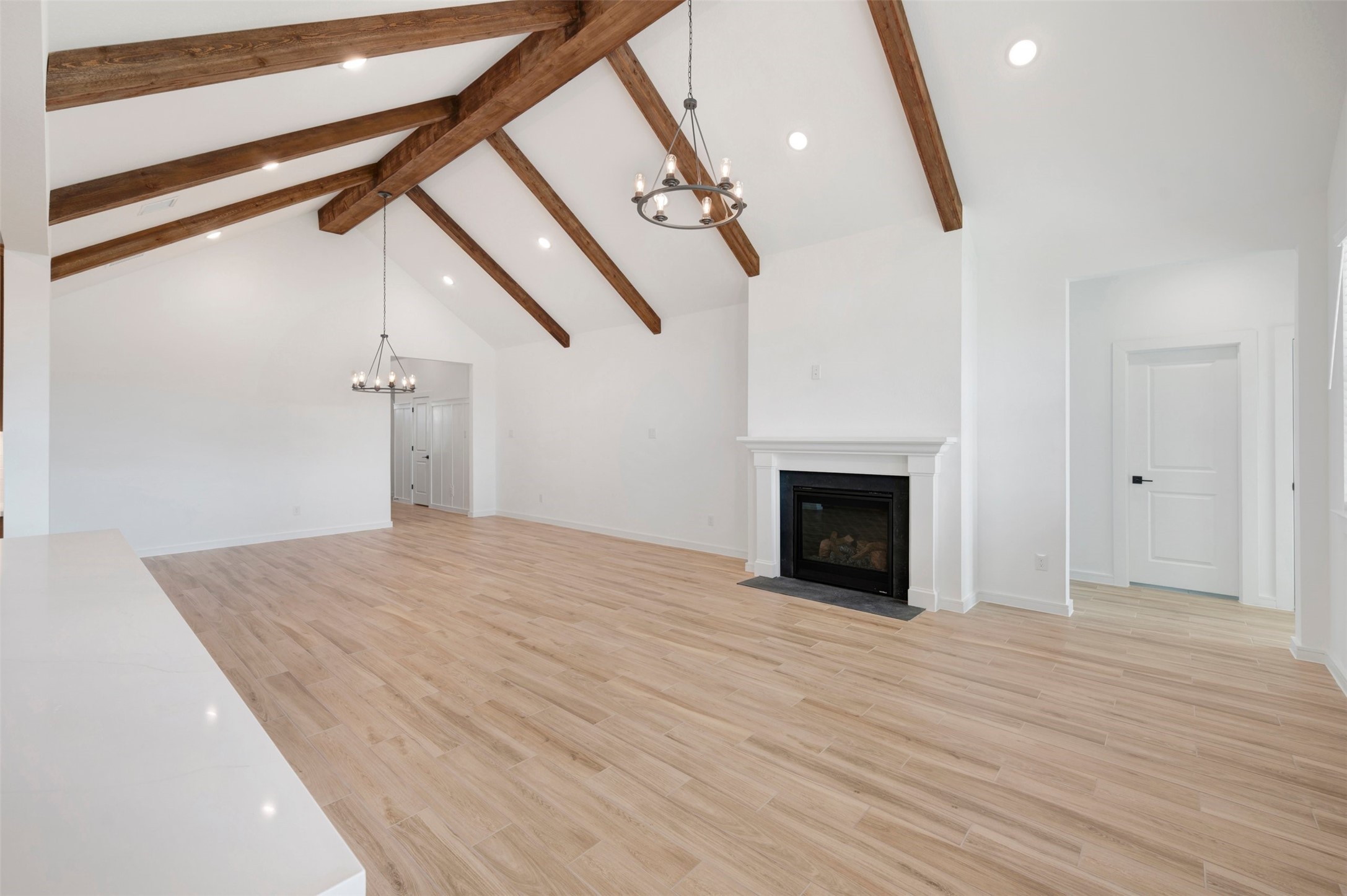 Airy living area with vaulted ceilings and stained beams