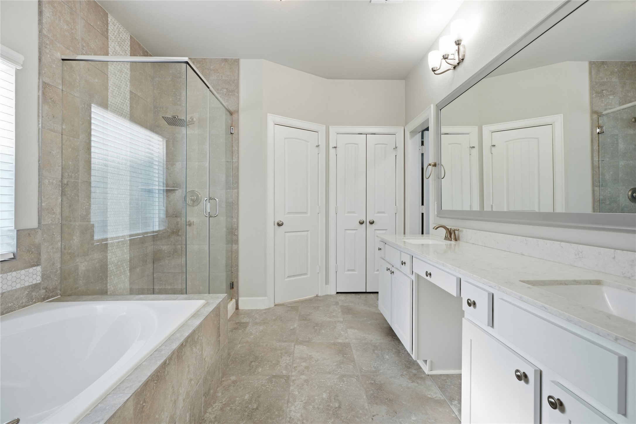 Relax and unwind in the soaking tub, complemented by a separate walk-in shower for added convenience.