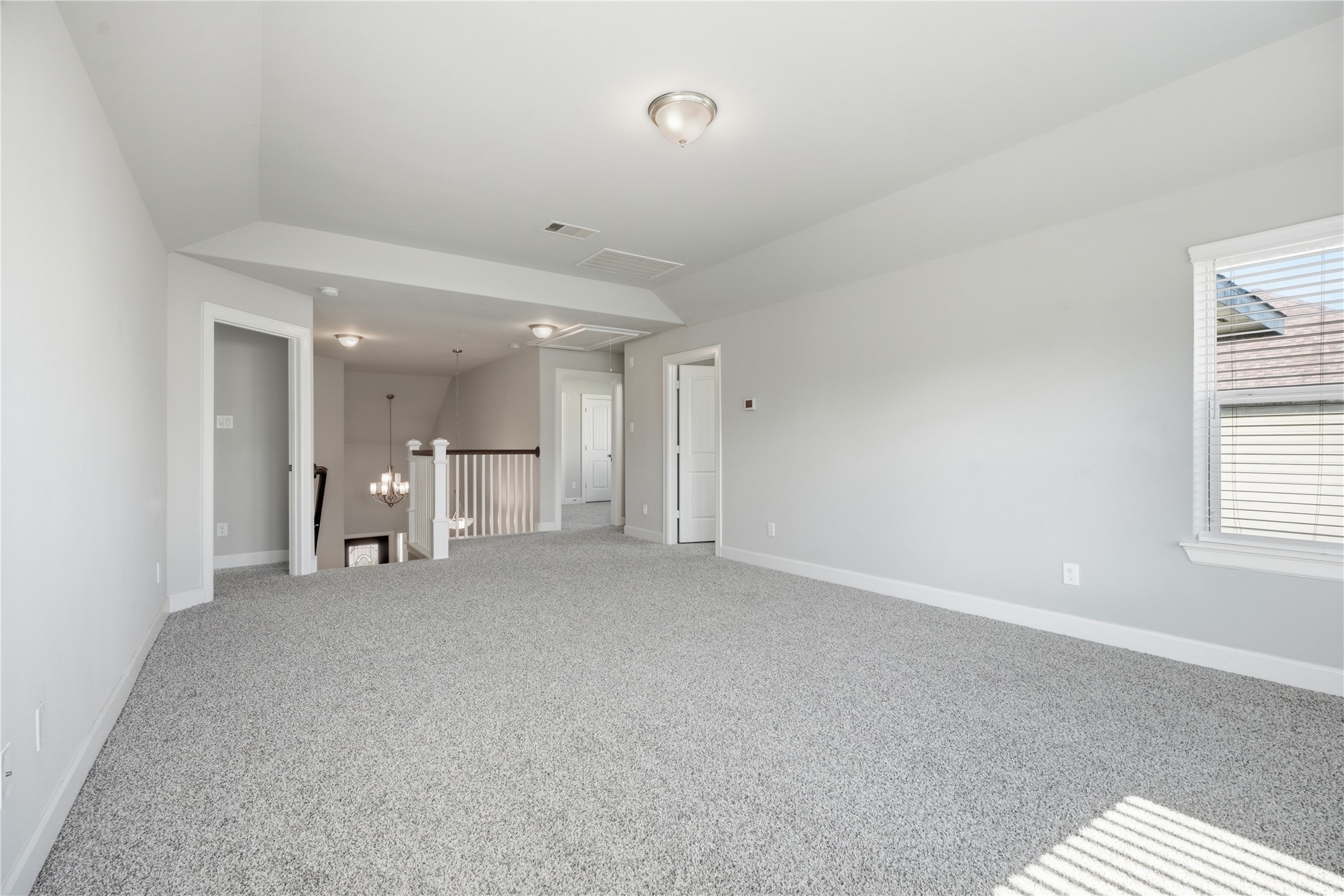 The game room separates the upstairs sleeping areas, with one bedroom located on one side and the additional bedrooms and full bathroom on the otheran ideal layout for added privacy.