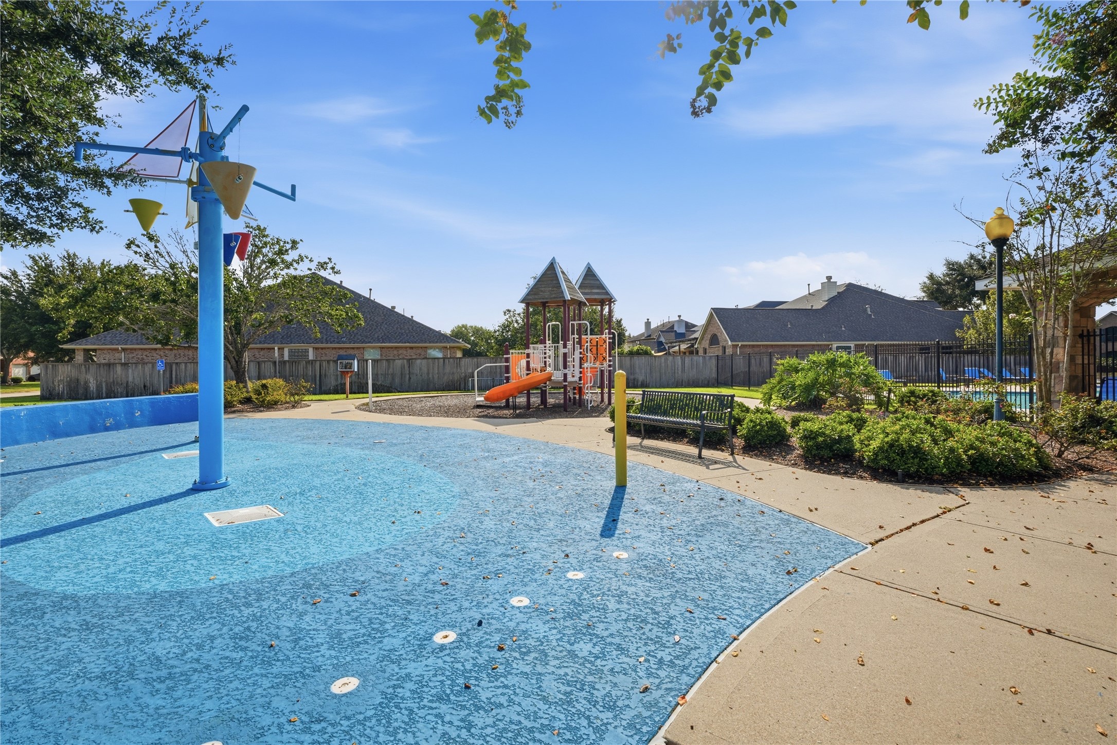 Colorful splash pad features multiple water-play structures and provides another way to enjoy the neighborhood amenities.