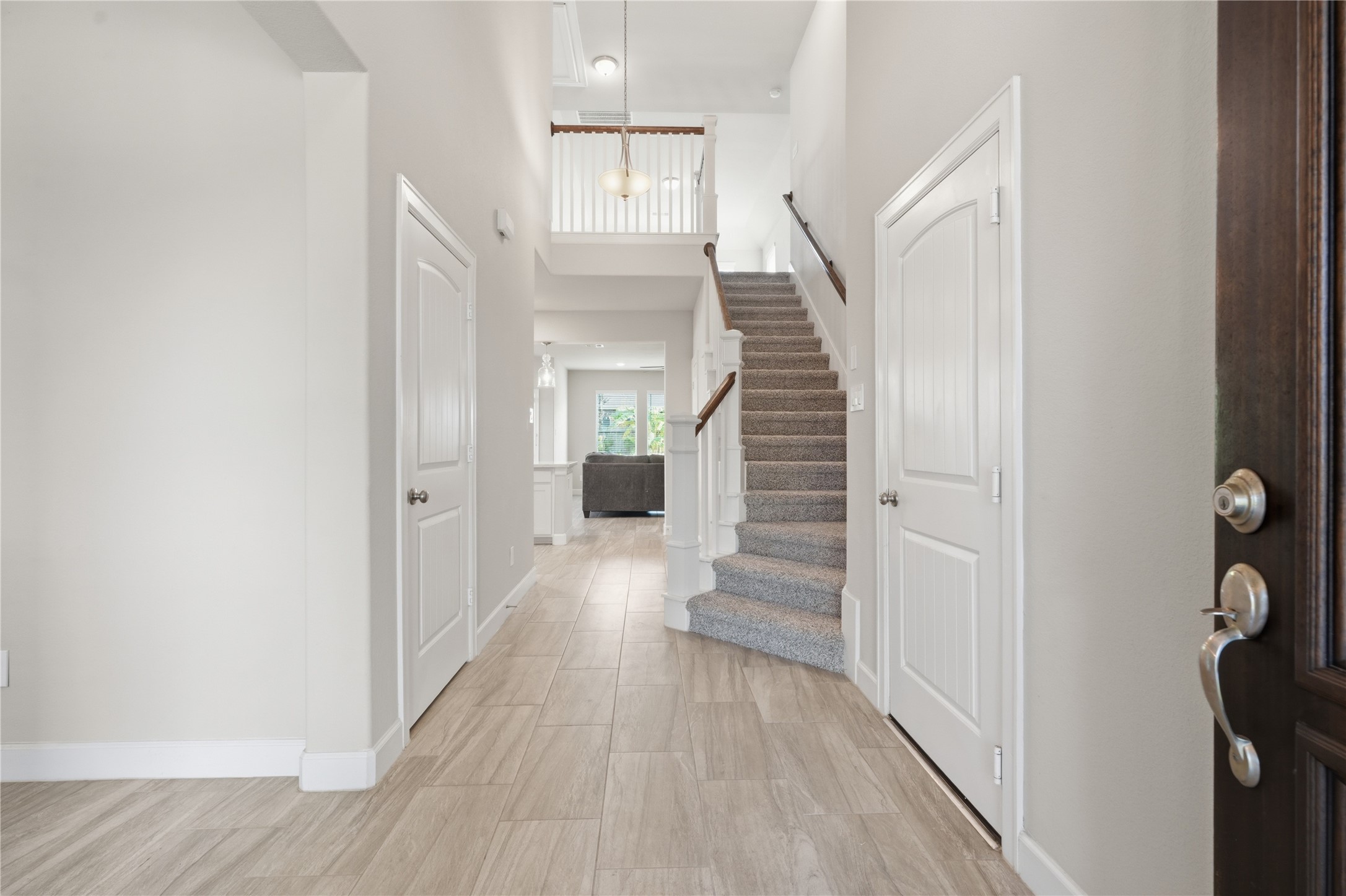 Step inside to a bright, welcoming entry featuring tile flooring and an open view into the main living areas.