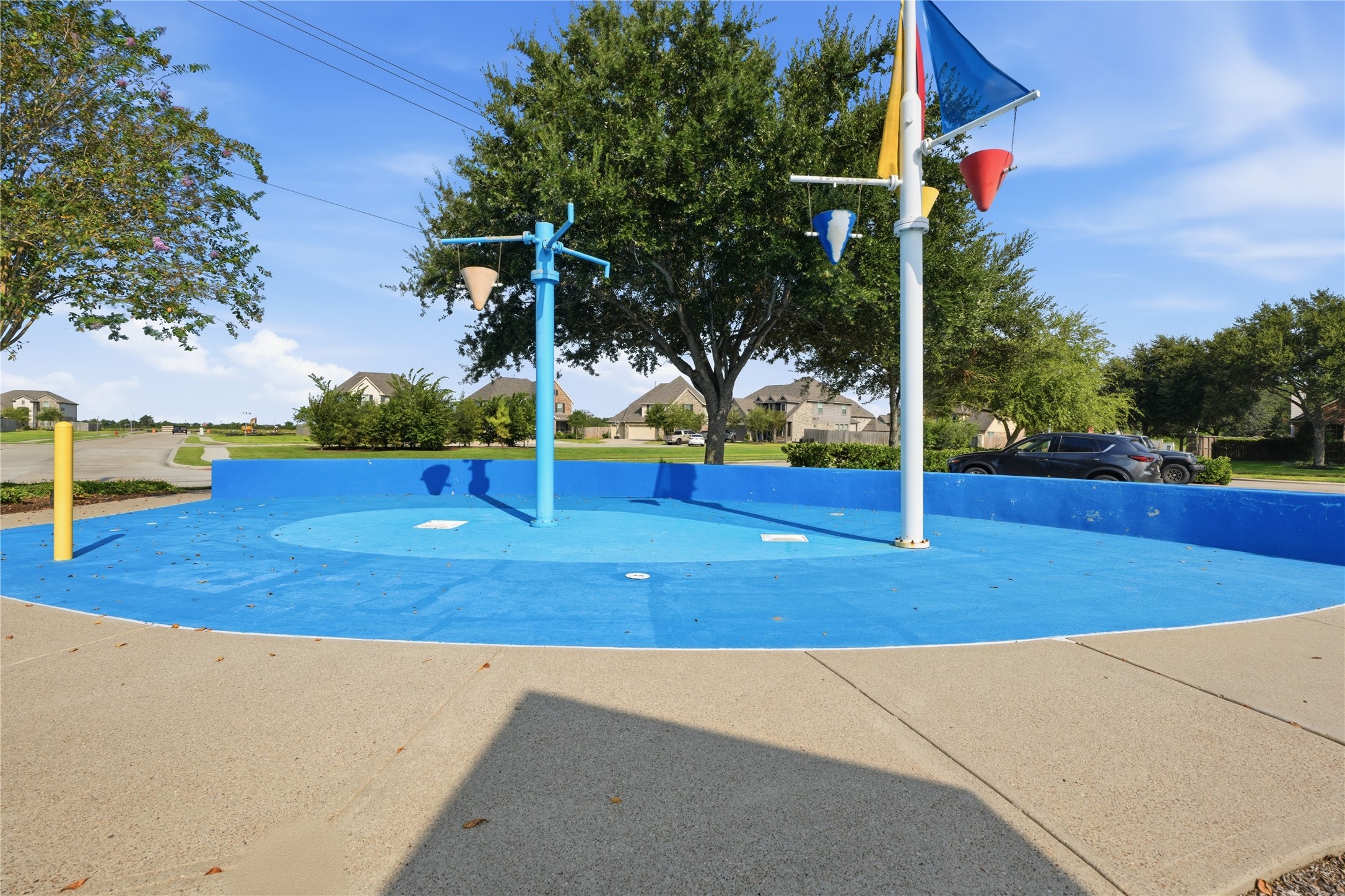 The neighborhood recreation area includes a playground along with a separate splash pad for additional outdoor fun.