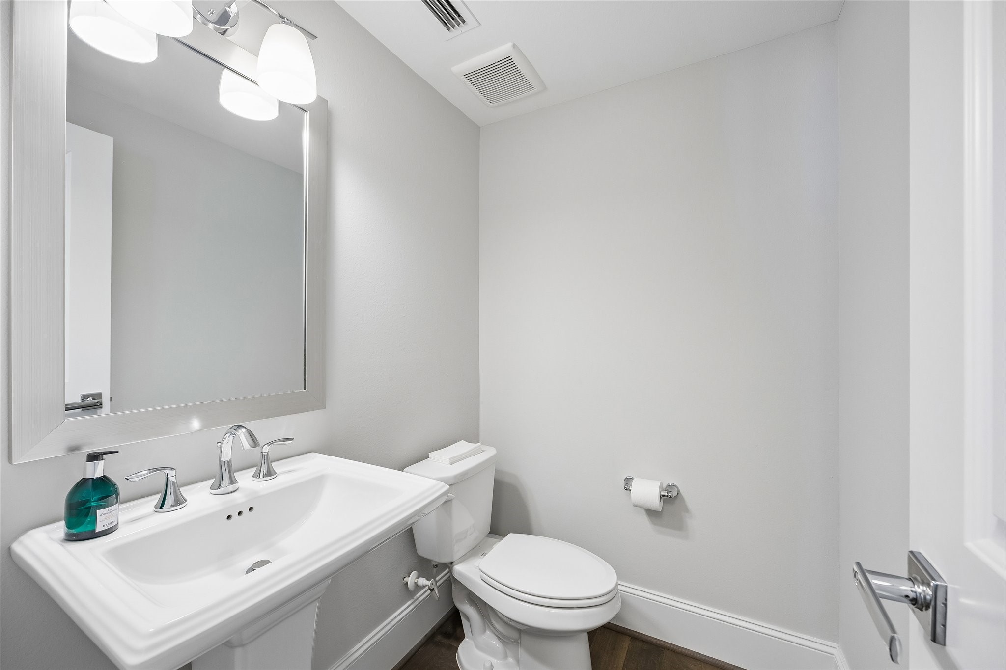 Conveniently located 2nd floor powder bath thoughtfully positioned to serve the home's main living & entertaining spaces. Features pedestal sink & easy access from the open-concept kitchen, dining & living areas. A wonderful addition providing comfort & convenience for guests without accessing the private bedroom suites!