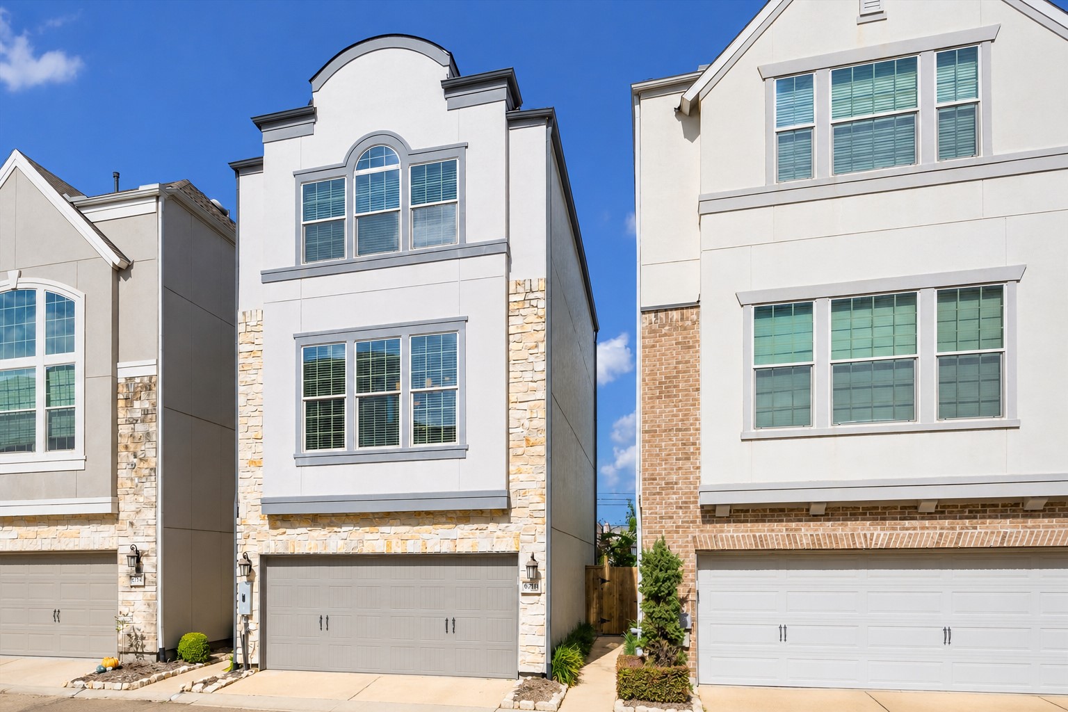 Another perspective of this lovely home highlighting the beautiful exterior w/ stone accents, attached 2-car garage & inviting architectural details. Built in 2016, this thoughtfully designed home features 2,306 SF (per HCAD) across 3 levels w/ open-concept living on the 2nd floor & spacious bedroom suites on the 1st & 3rd floors. No carpet throughout! HVAC recently serviced.