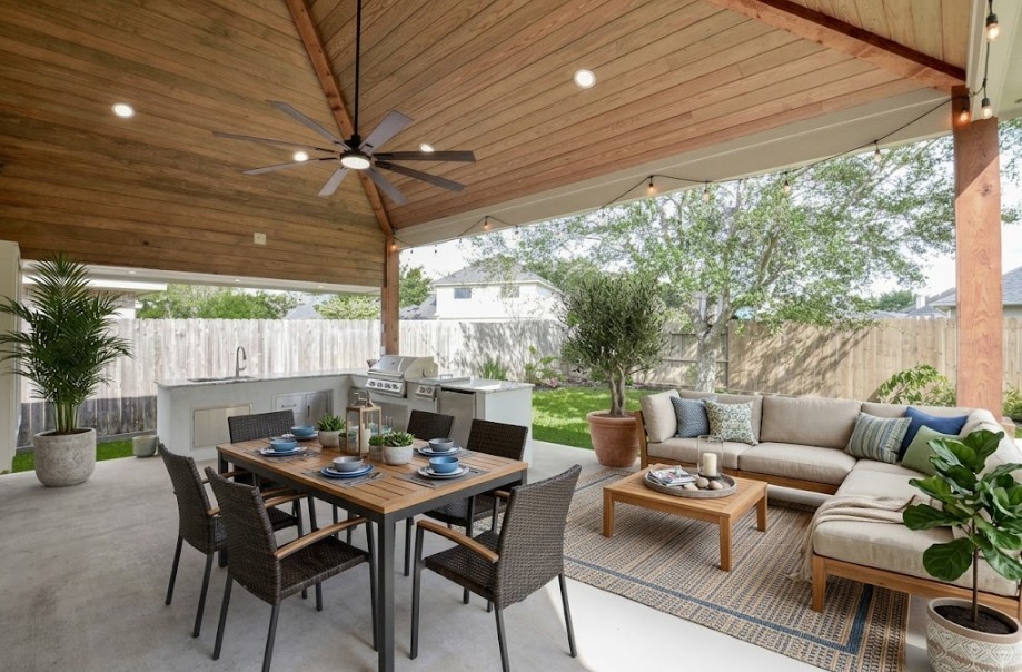Experience the perfect blend of relaxation and entertainment on this stunning covered patio, complete with a sleek outdoor kitchen, beautifully staged to inspire your dream gatherings.