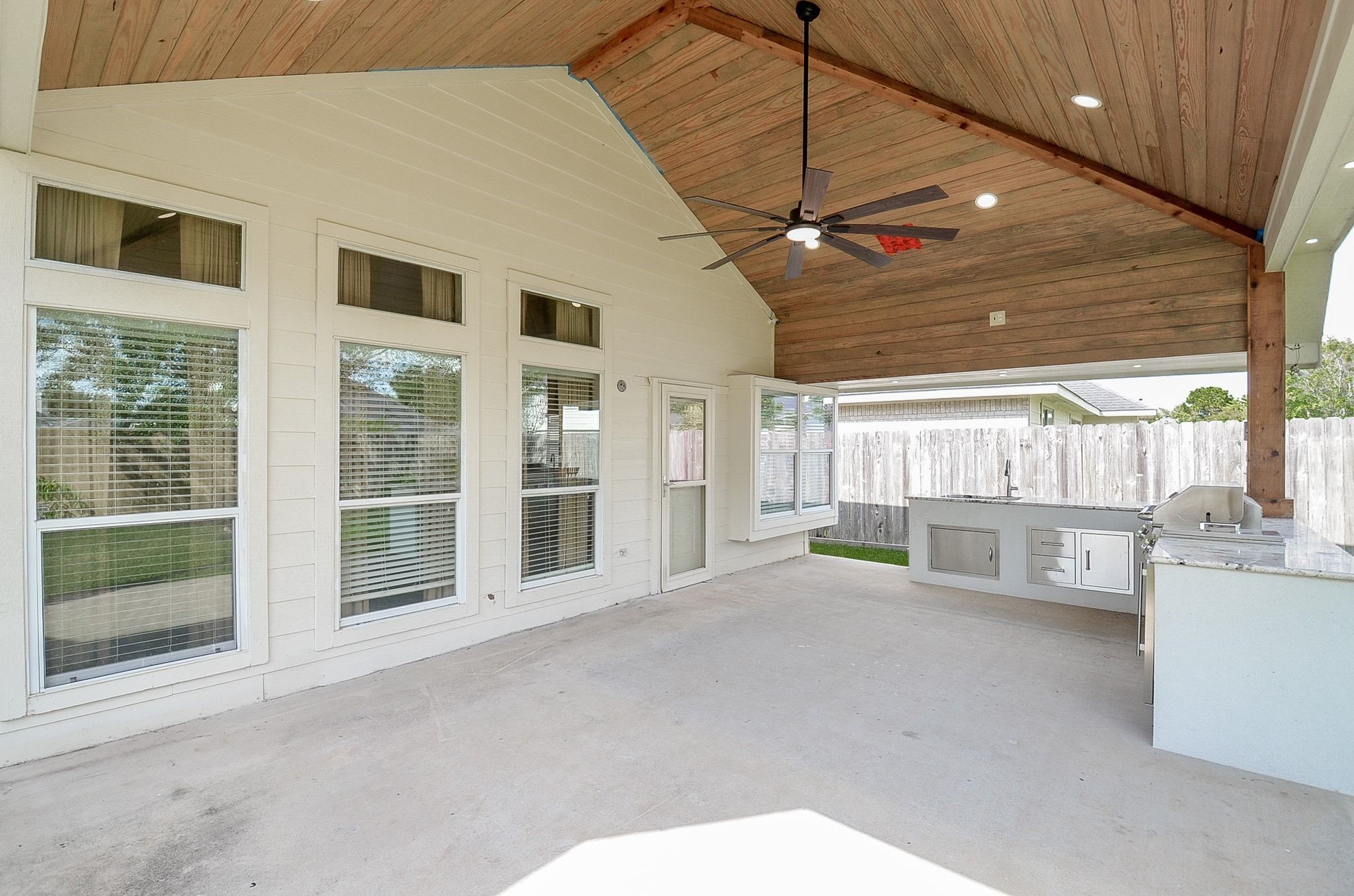 New covered patio with outdoor kitchen