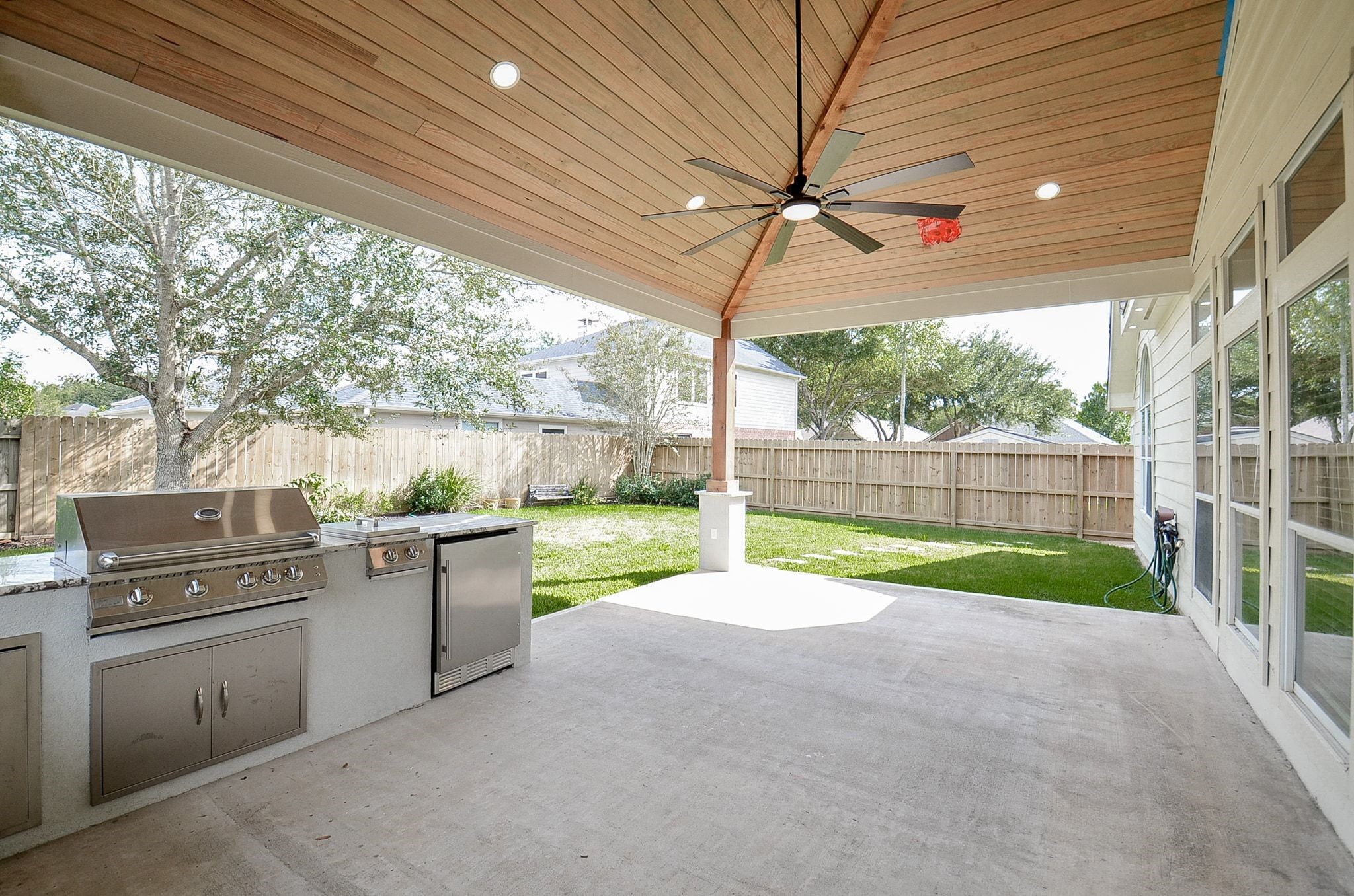 New covered patio with outdoor kitchen