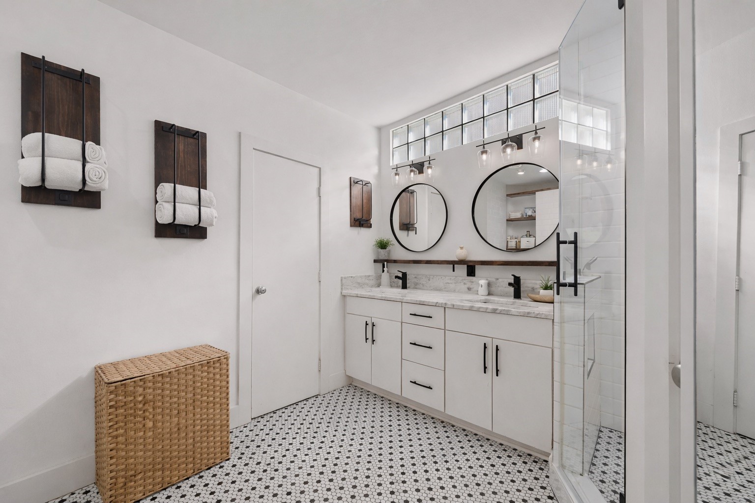 Experience luxury with this primary bathroom's spacious layout, featuring elegant double sinks and modern design.