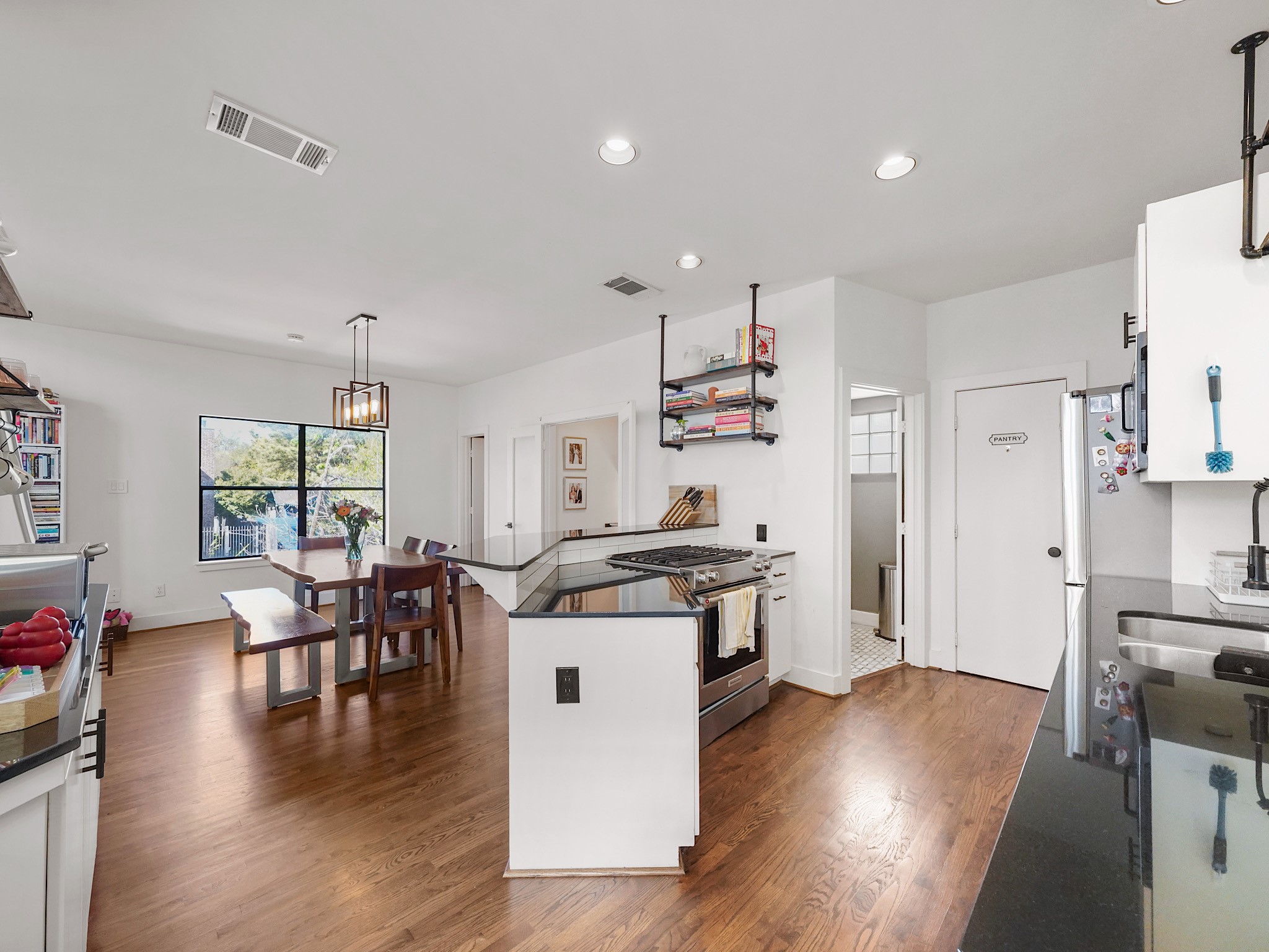 This inviting space boasts a seamless flow from the kitchen to the connected dining area, perfect for effortless entertaining and everyday living.