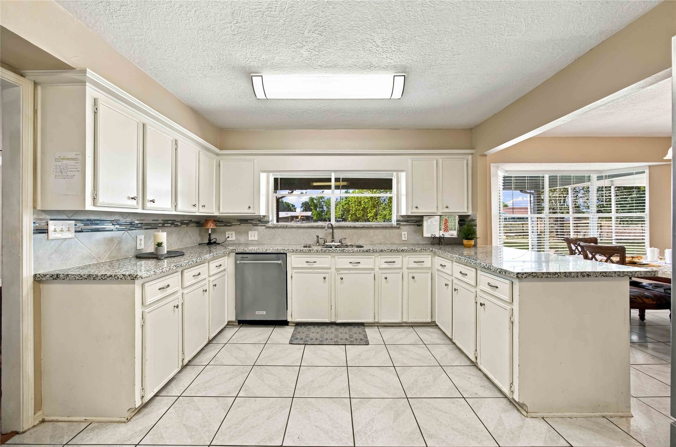 Another great view of the property from the Kitchen window. Granite countertop and lots of counters and cabinets.
