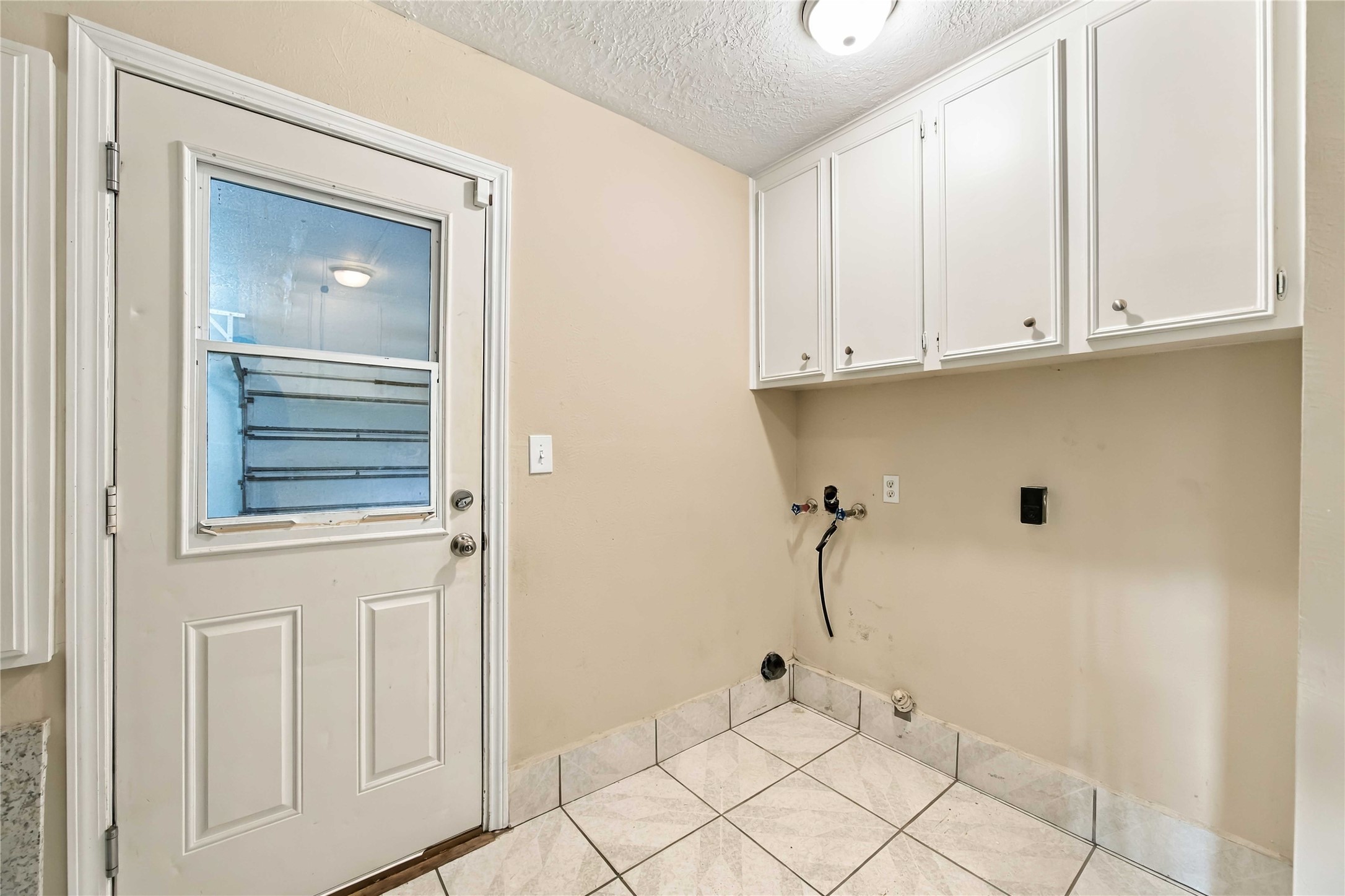 Laundry room on one side.