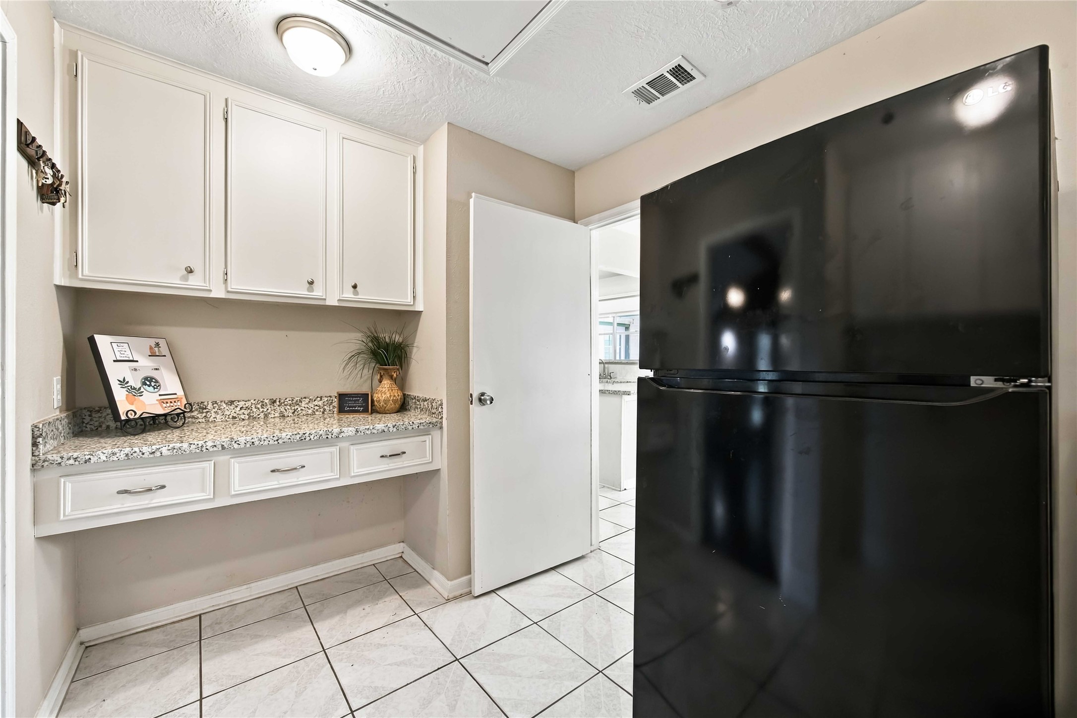 Laundry room on the other side. Large enough for that extra refrigerator.