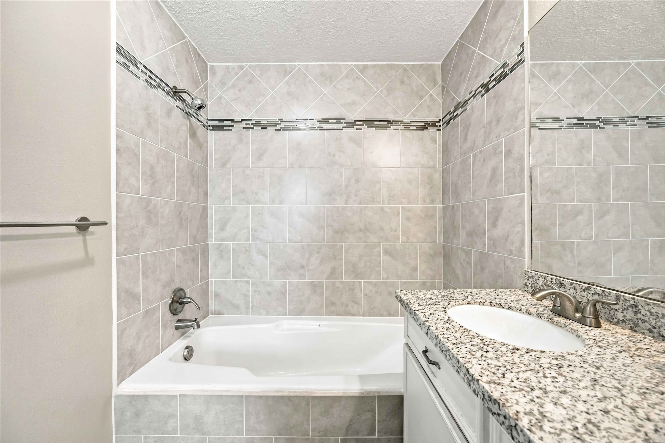 Insert tile in both the tub/shower combo and the separate shower.
