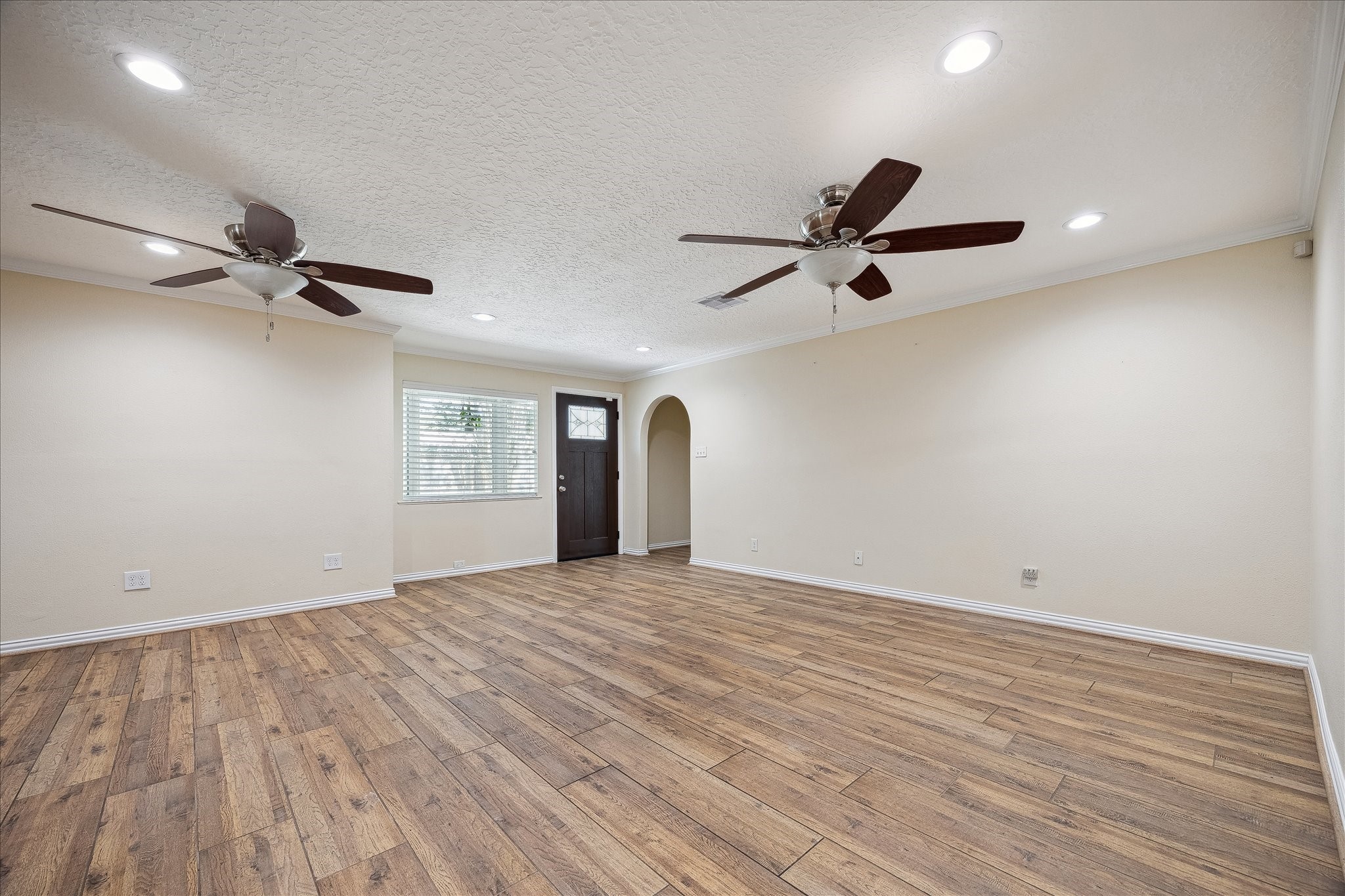 Open concept living / dining with wood look tile floors throughout