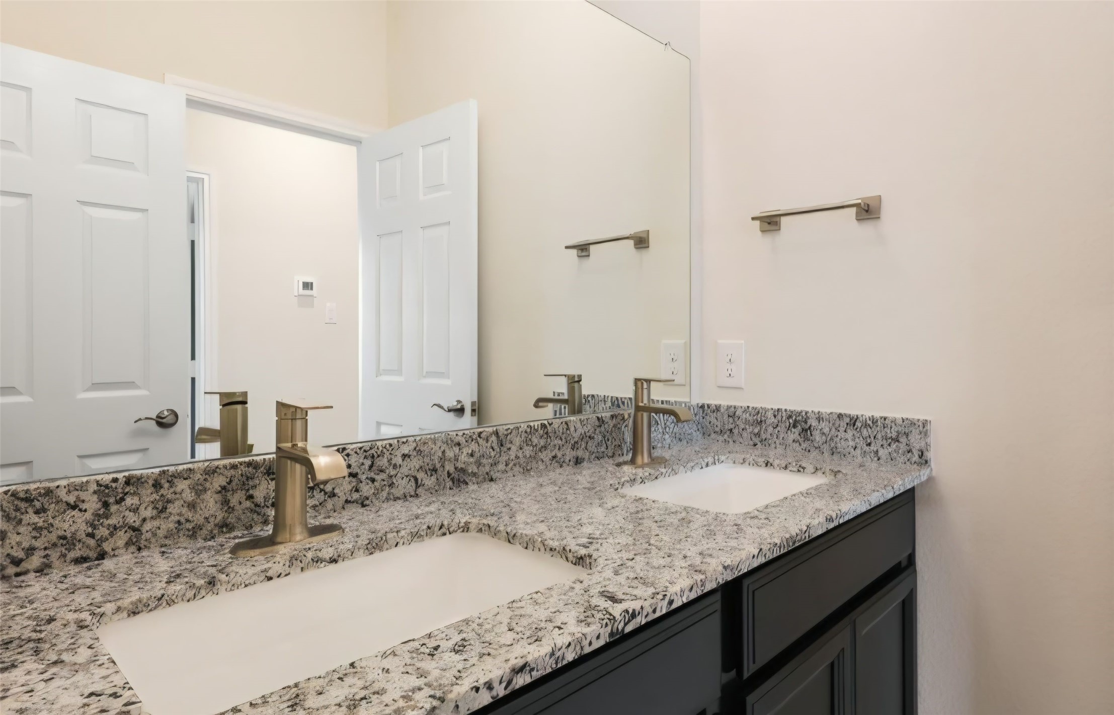Primary bedroom has nice dual vanity sinks