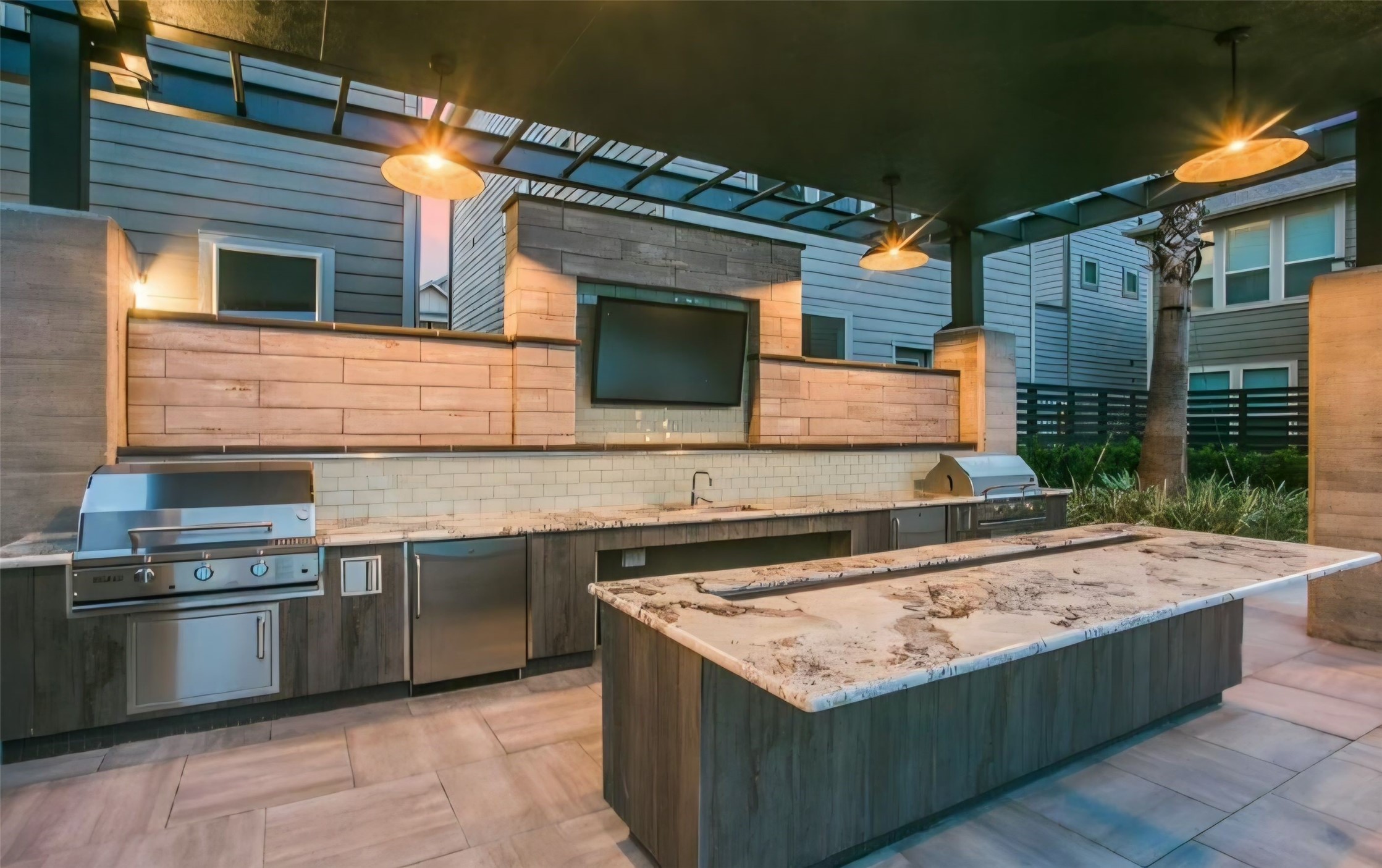 Community outdoor covered kitchen within the pool area, great for entertaining and a small family gathering event