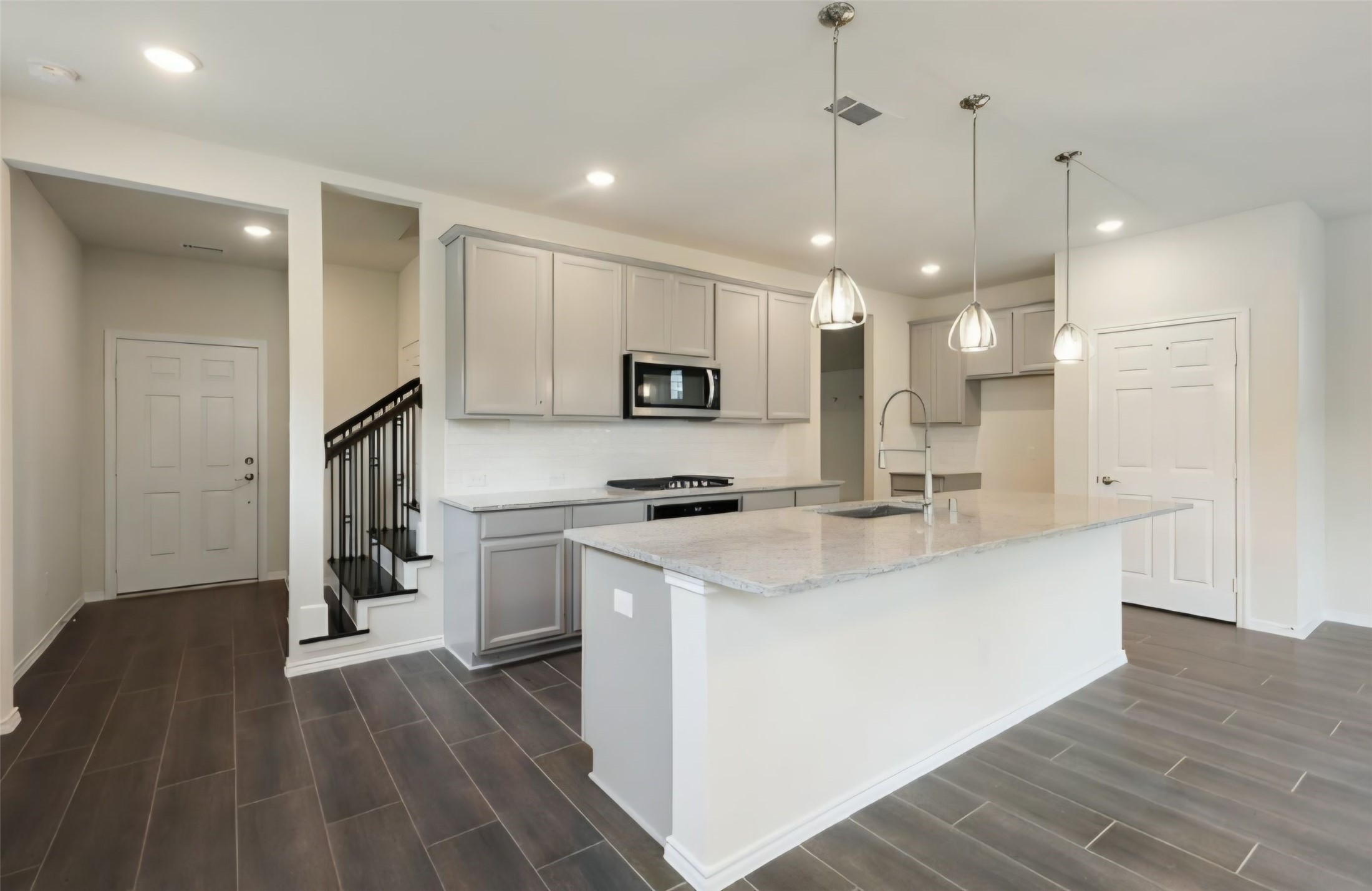 Kitchen and family areas have practical recessed lighting