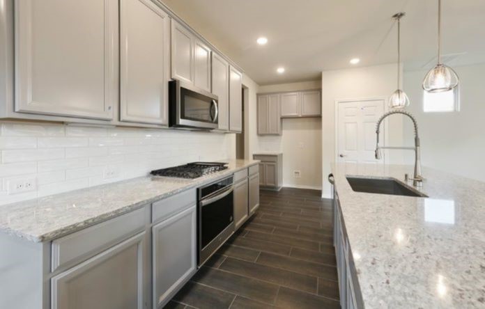 Spacious sink-in island kitchen with good amounts of counter space and cabinetry
