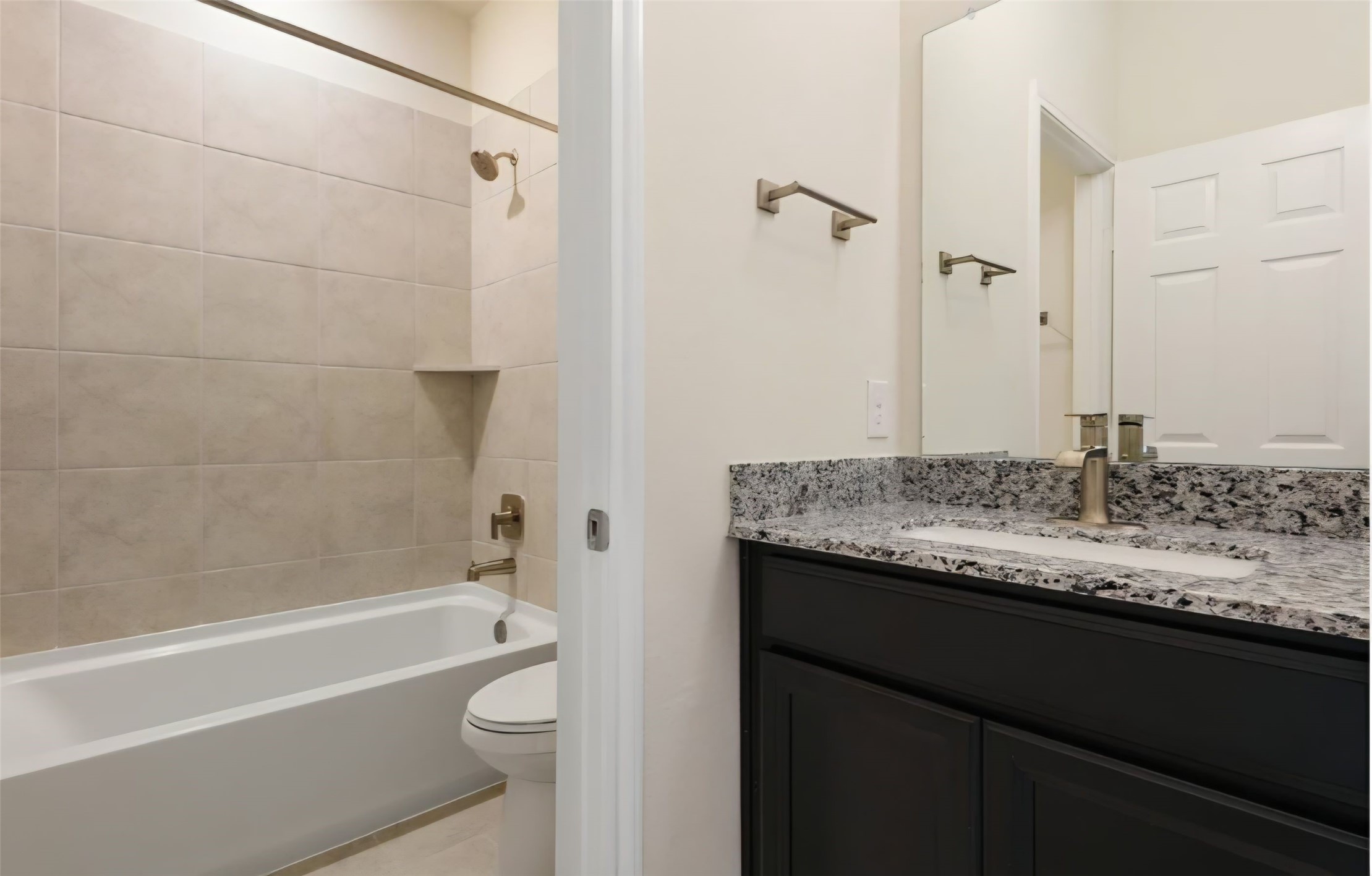 Hall full bath servicing both secondary bedrooms