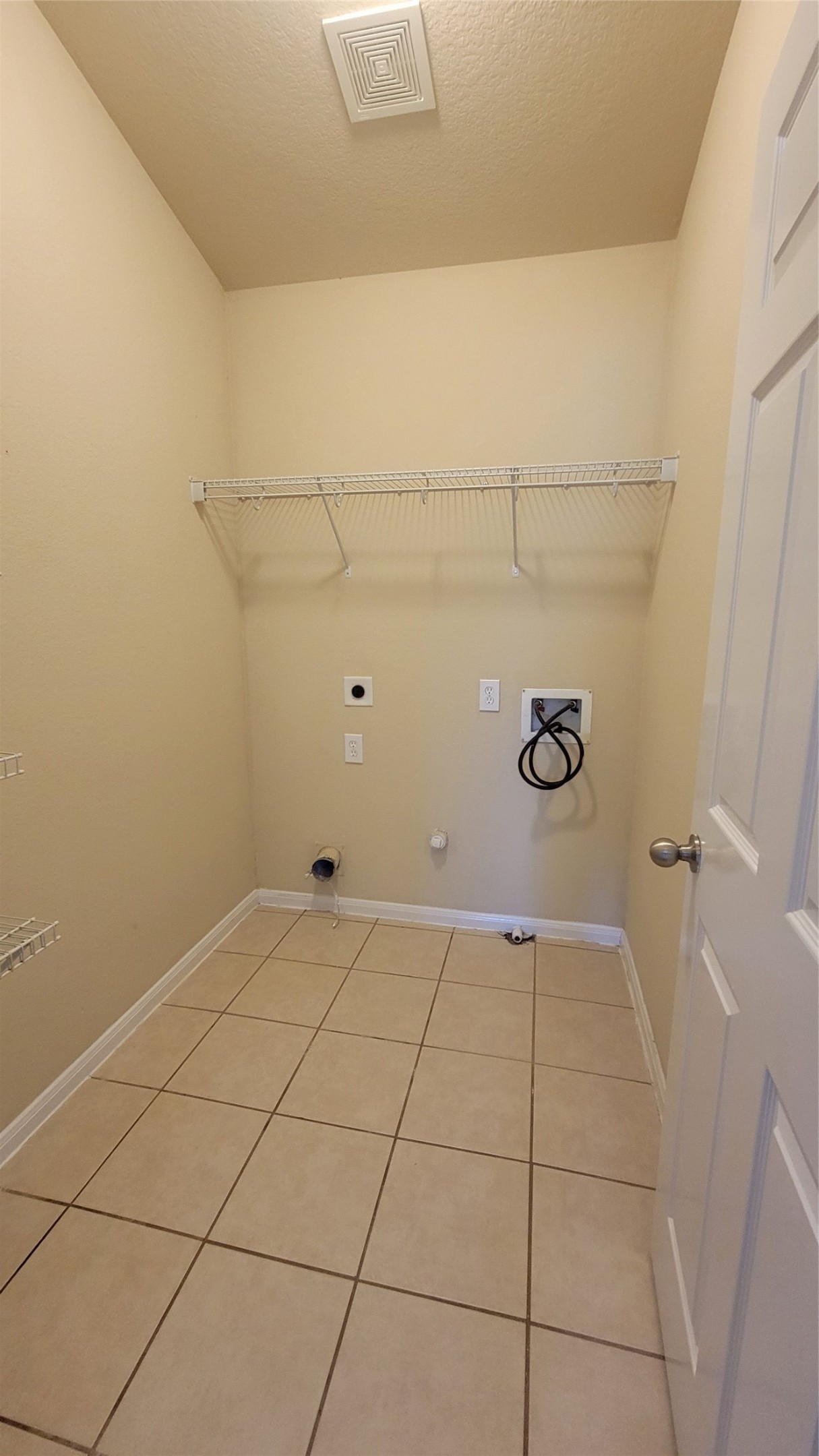 Convenient laundry room with washer and dryer hookups.