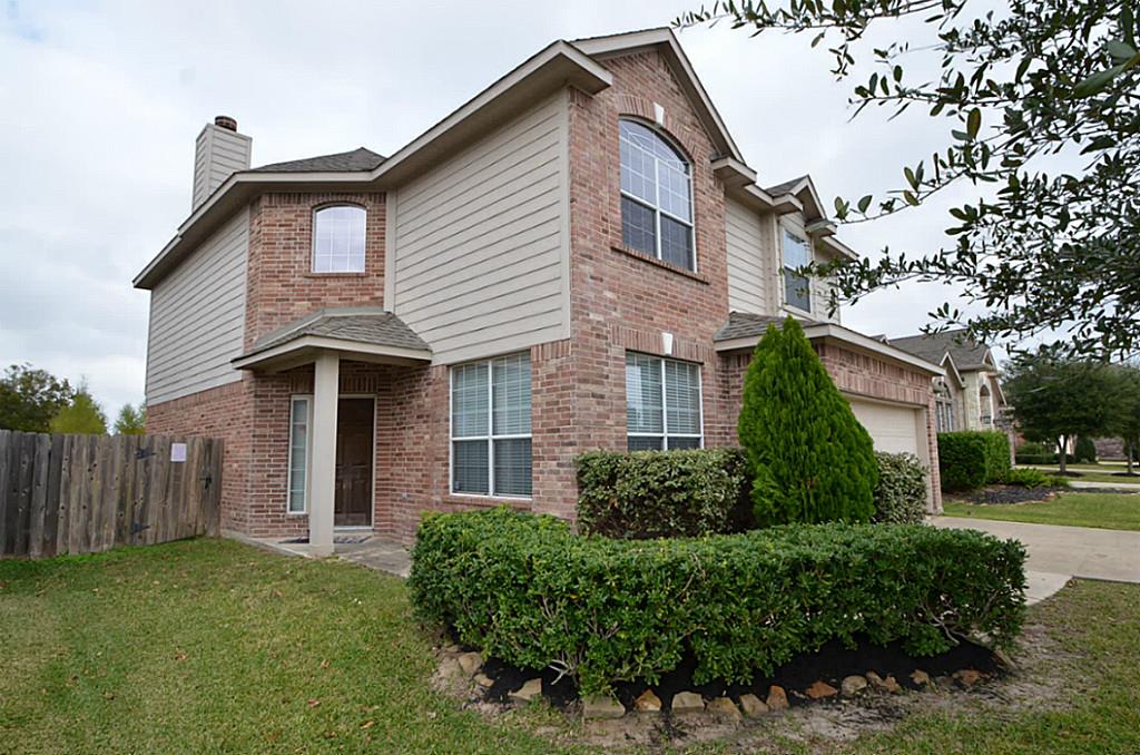 Stylish two-story home featuring elegant brown brick exterior. Stylish two-story home featuring elegant brown brick exterior.
